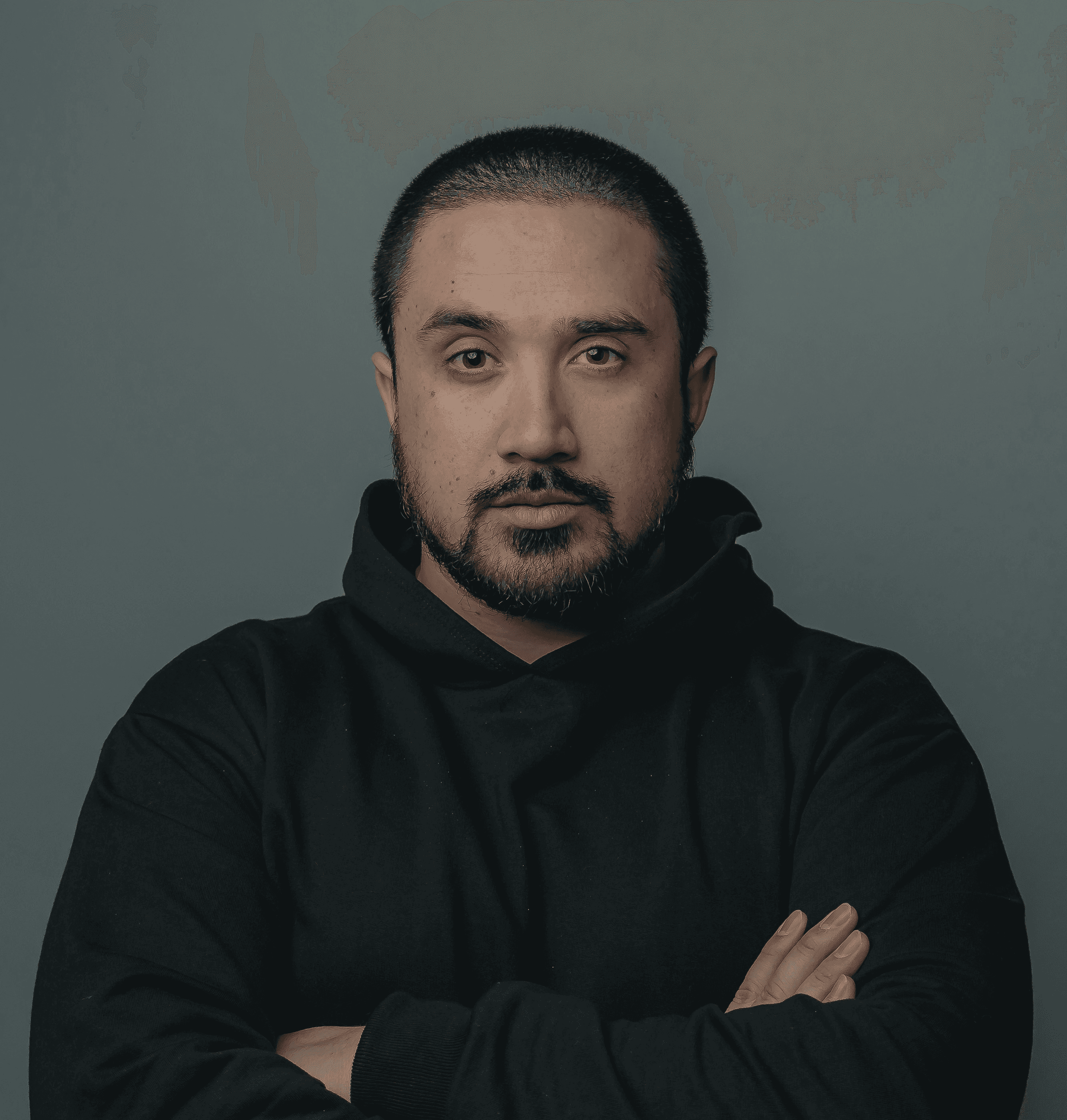 man in black hoodie standing