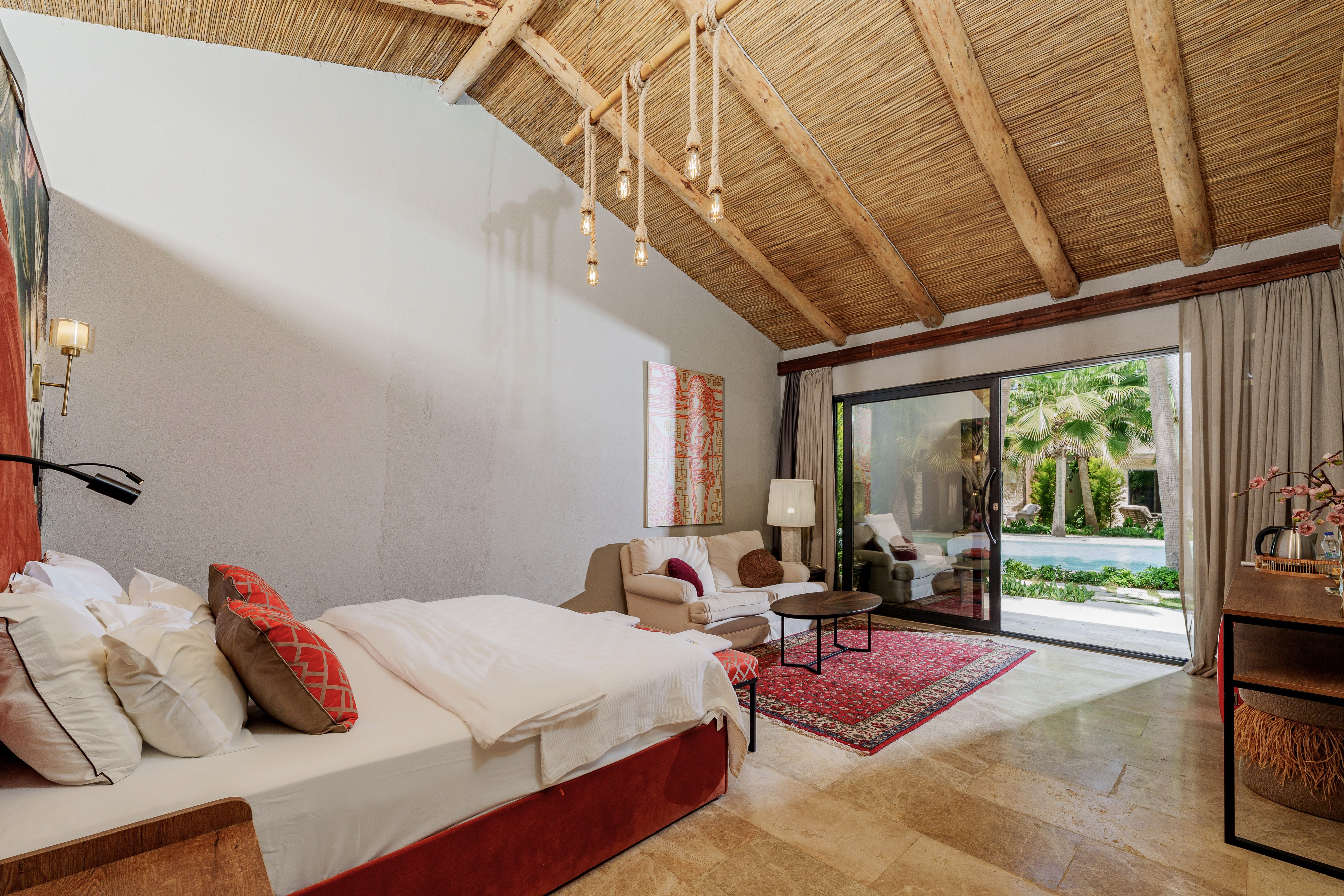 Living area composition, mid-century modern sofa, light wooden coffee table, woven textures, and curated coastal decor.