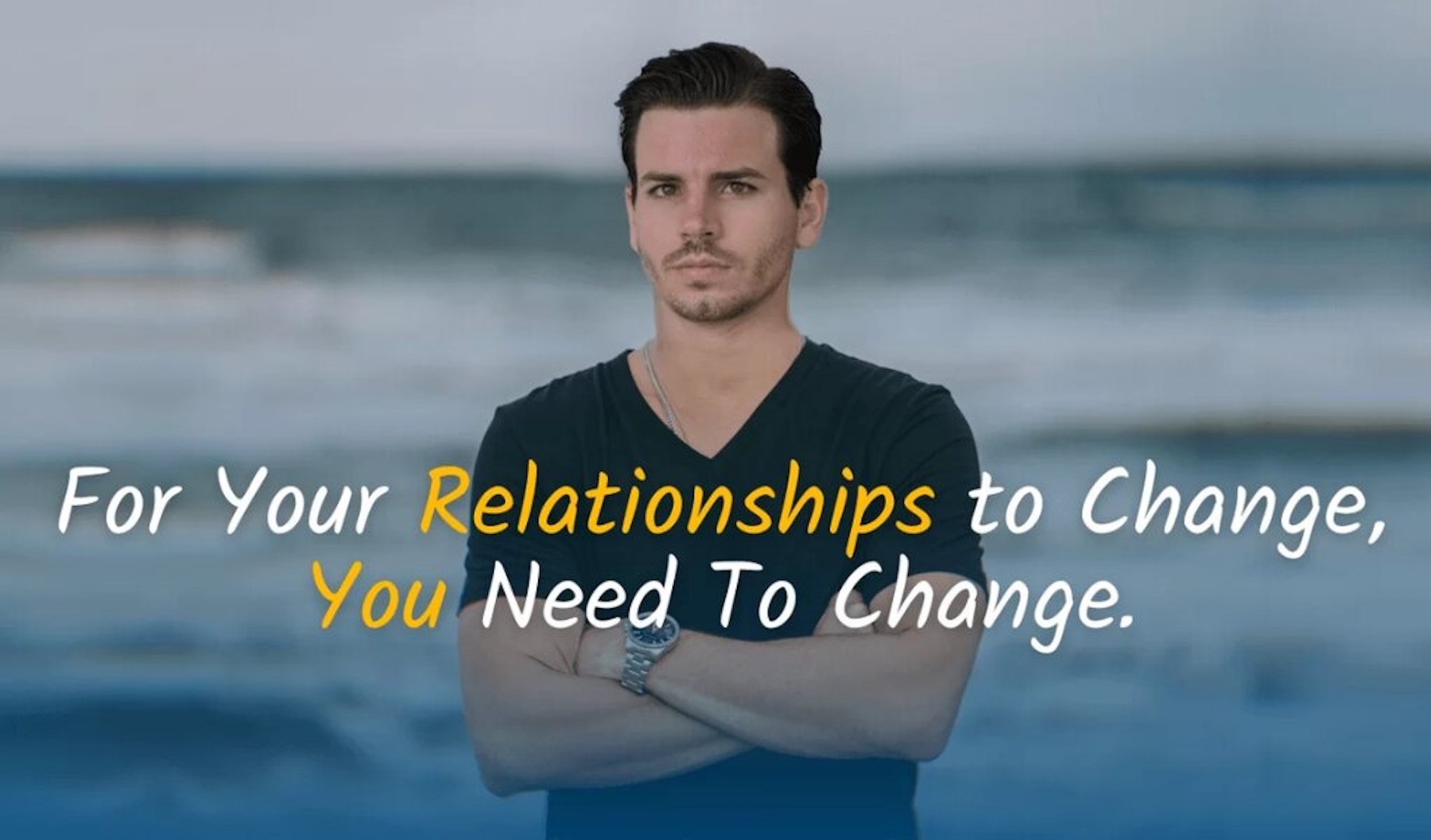 Relationship coach Ismael Gomez stands by the ocean with quote about personal change and relationships.