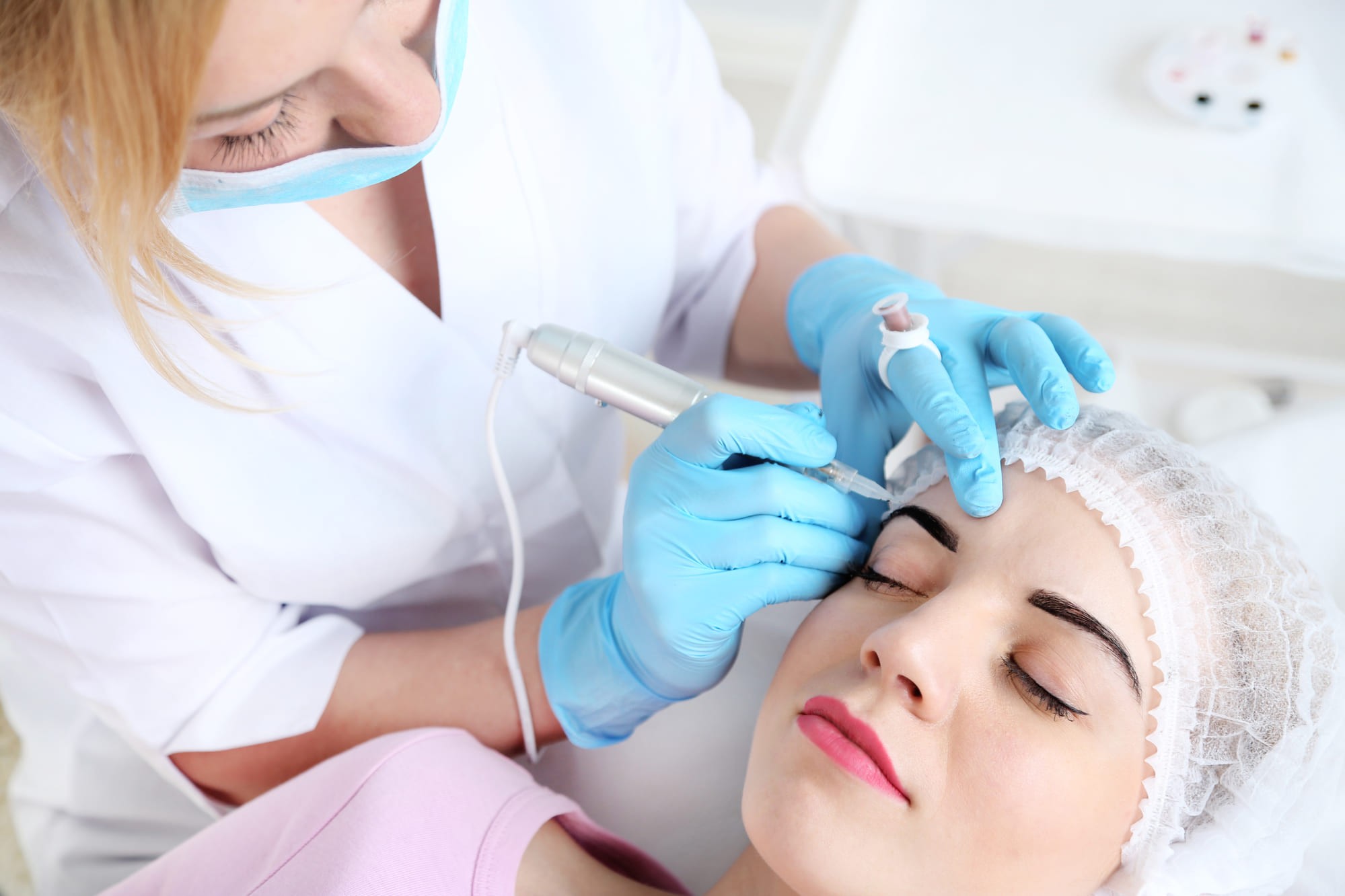 Permanent makeup being applied on patient