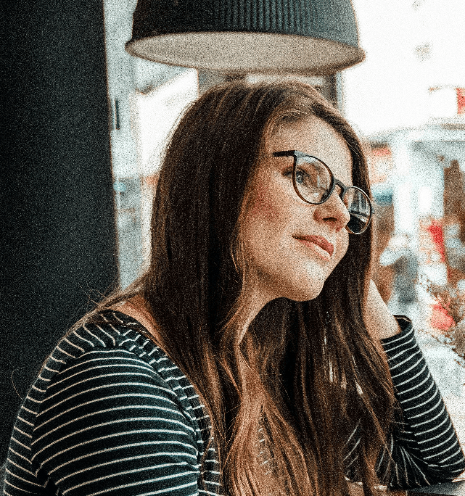 woman leaning at the table