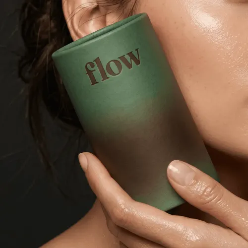 Hand holds 'flow' product, expert branding design art.