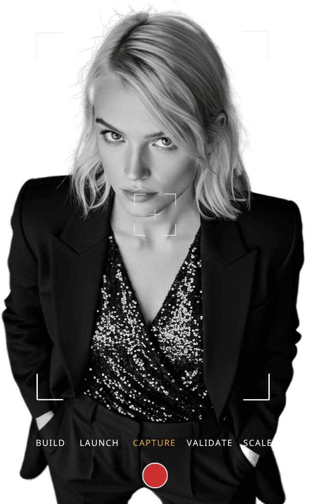 Professional woman in a suit standing in an office setting.