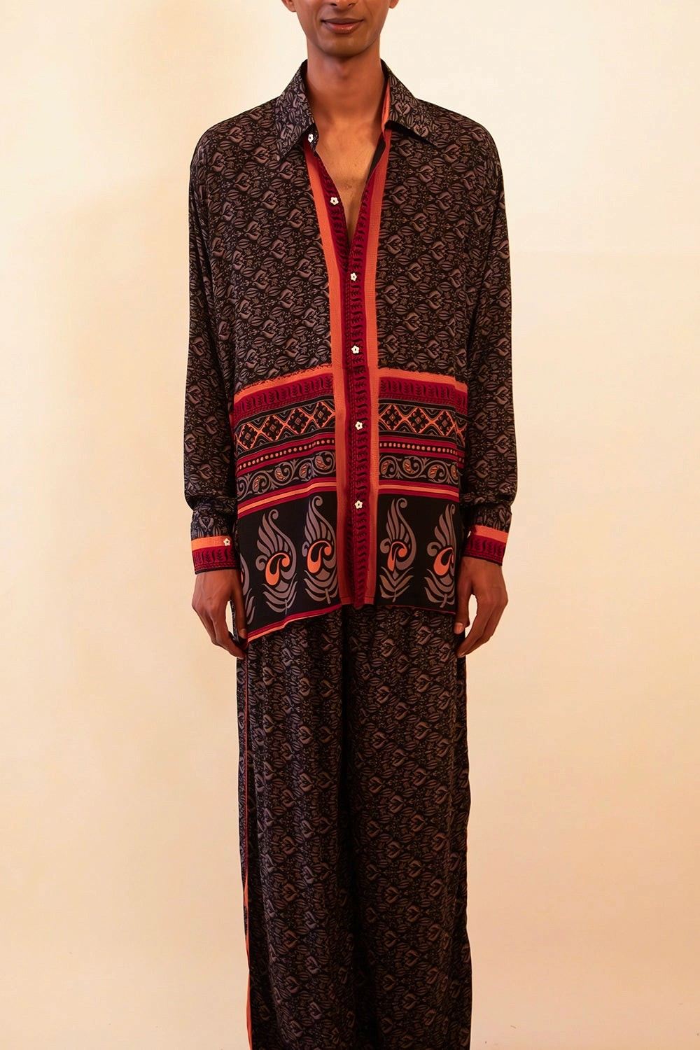 Lavya is our one-of-a-kind black and red shirt and pant set, handcrafted by skilled artisans in-house using a one-of-a-kind vintage silk saree. 