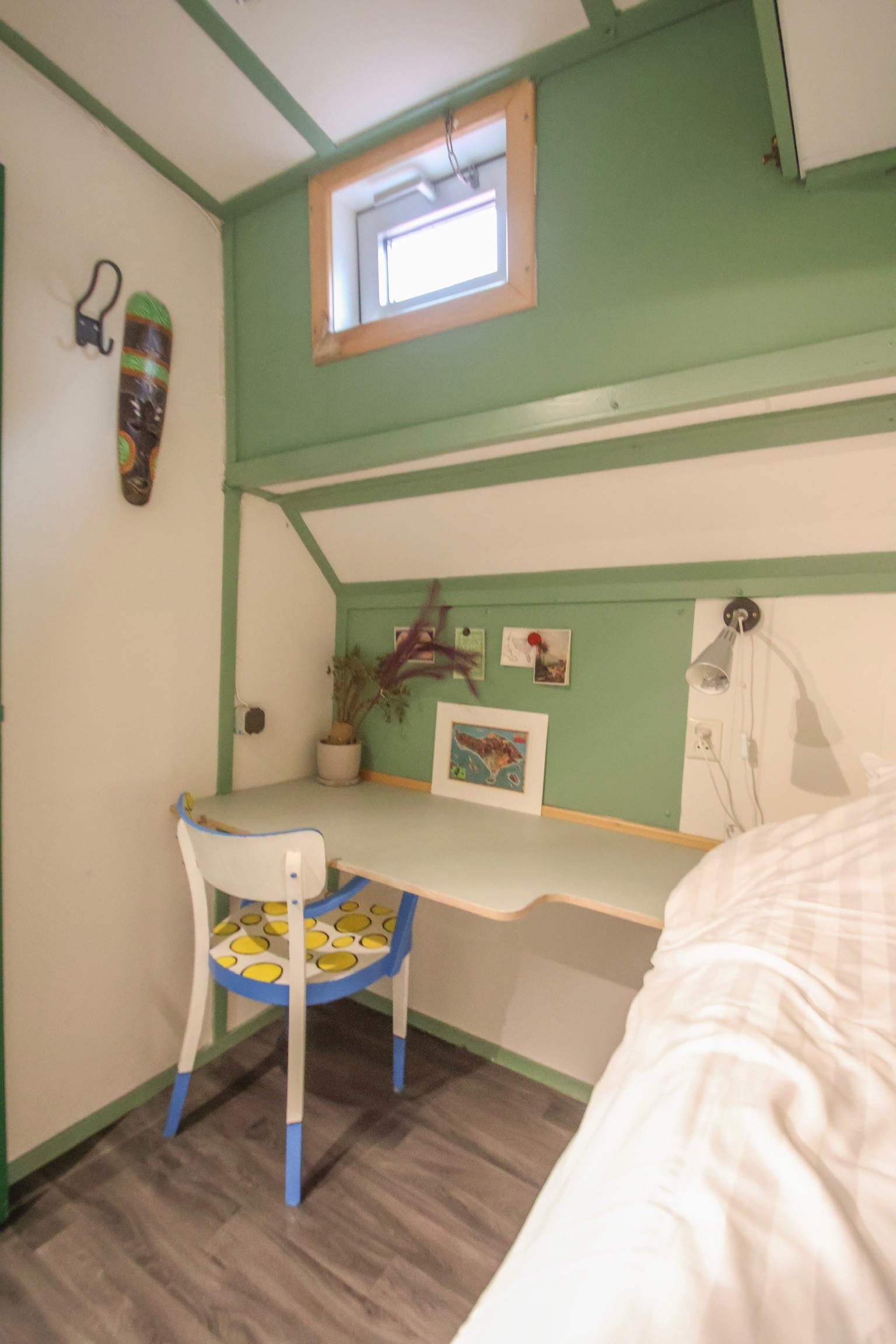 Gray sectional sofa with black coffee table and blue rug