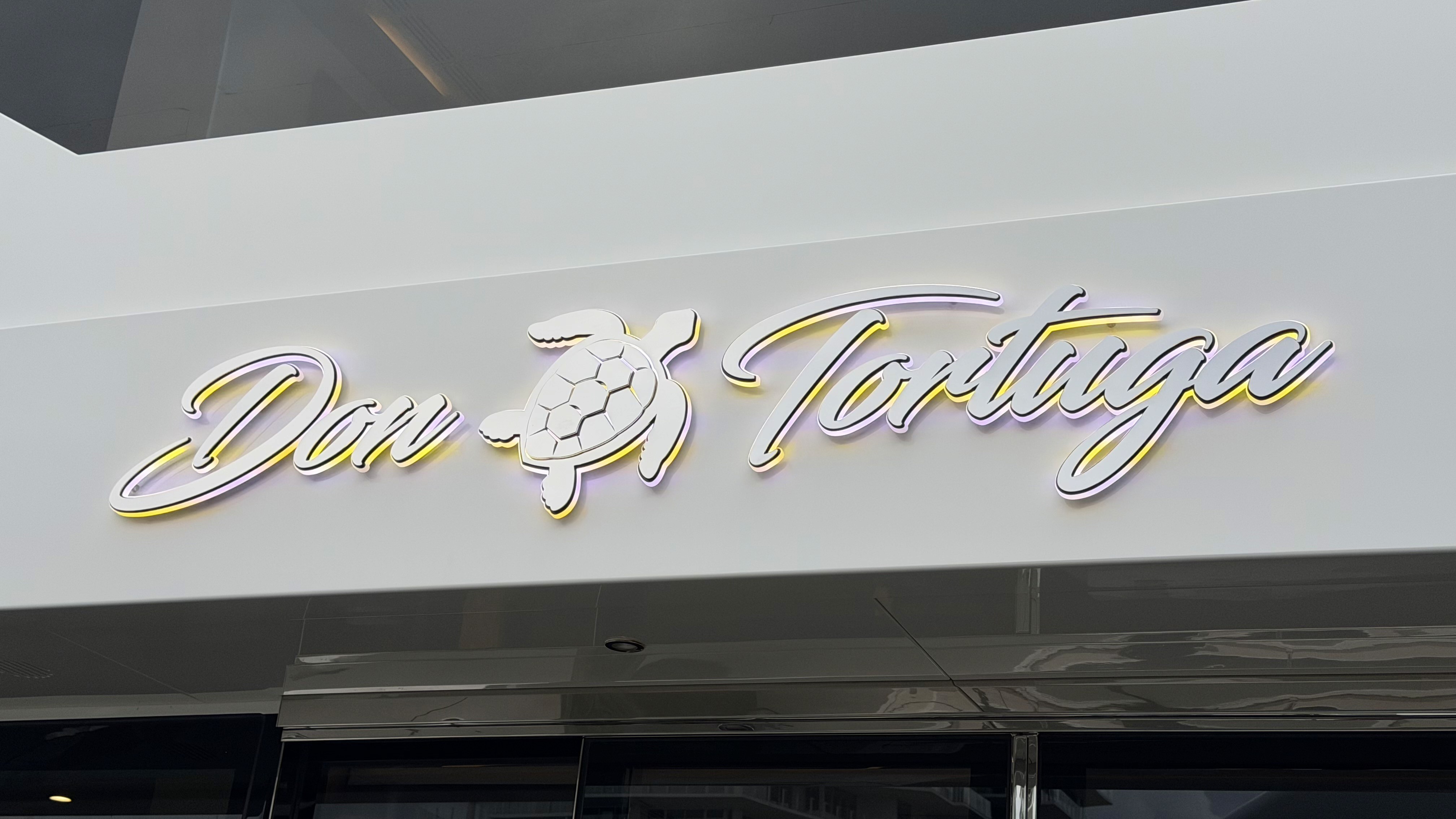 Custom gold script yacht name lettering Don Tortuga
