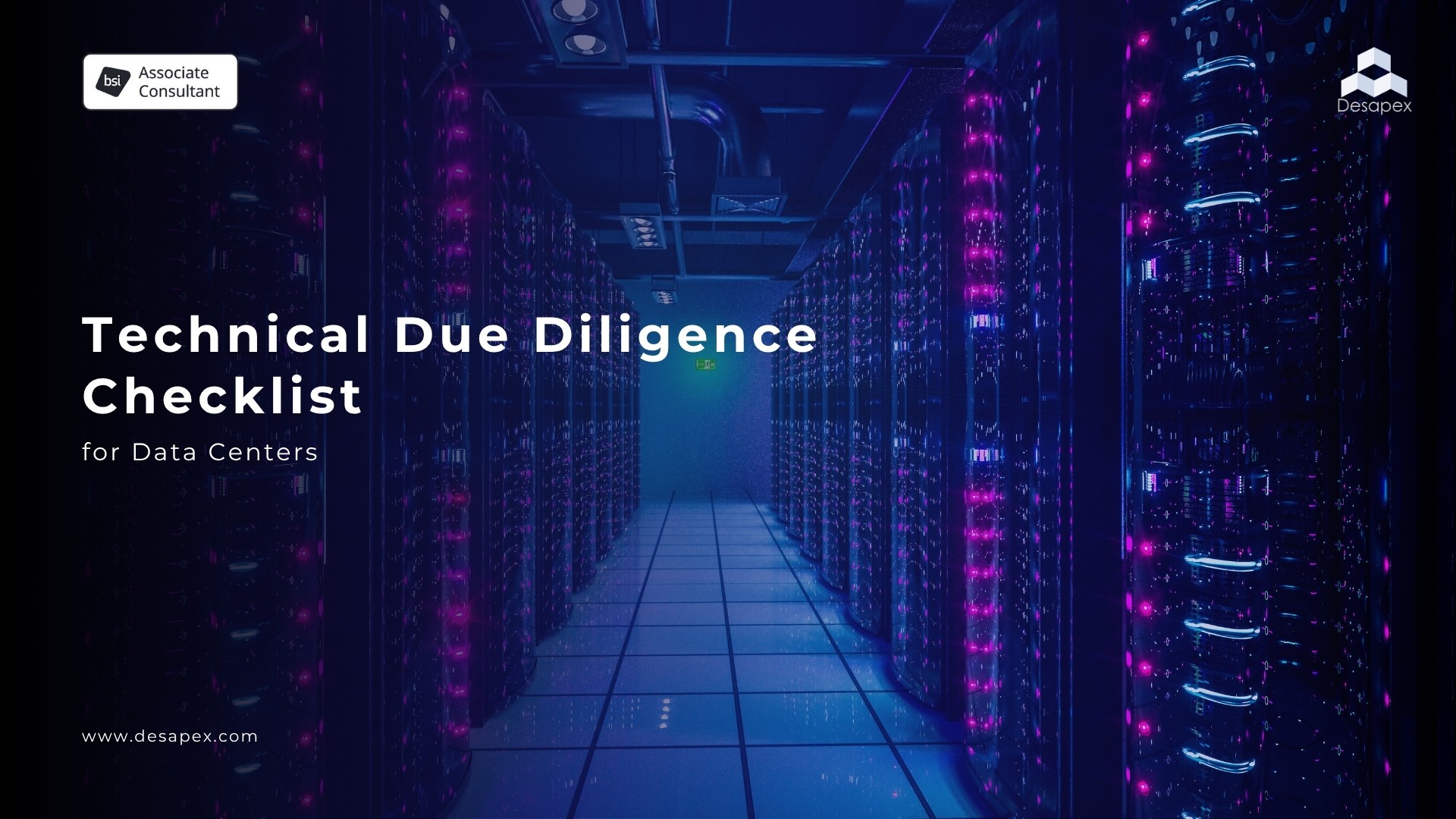 A man stands while two people sit at a table in an office setting, smiling and engaged in conversation. The mood is friendly and collaborative.