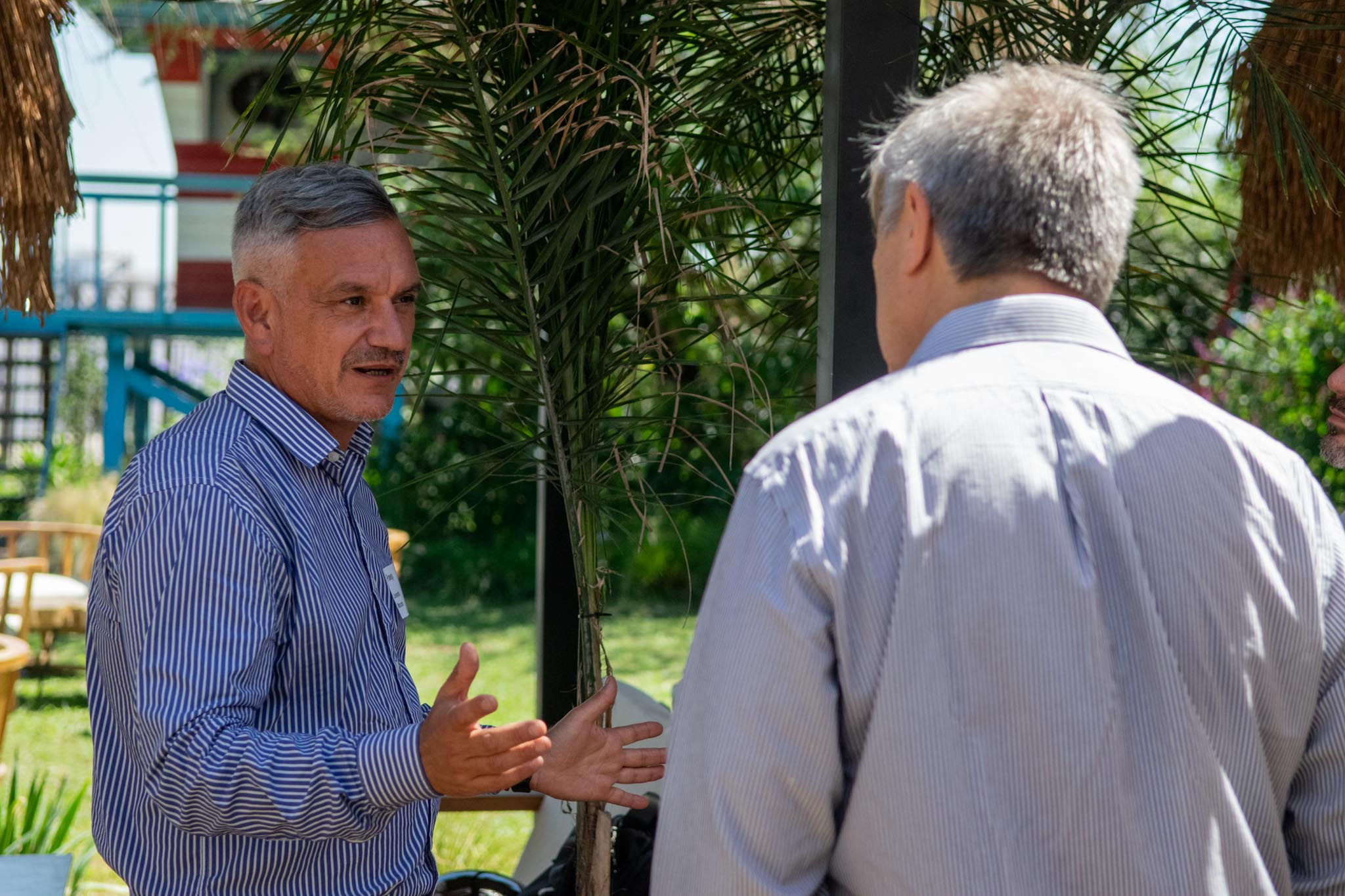 Photo Of People Sitting On Chairs