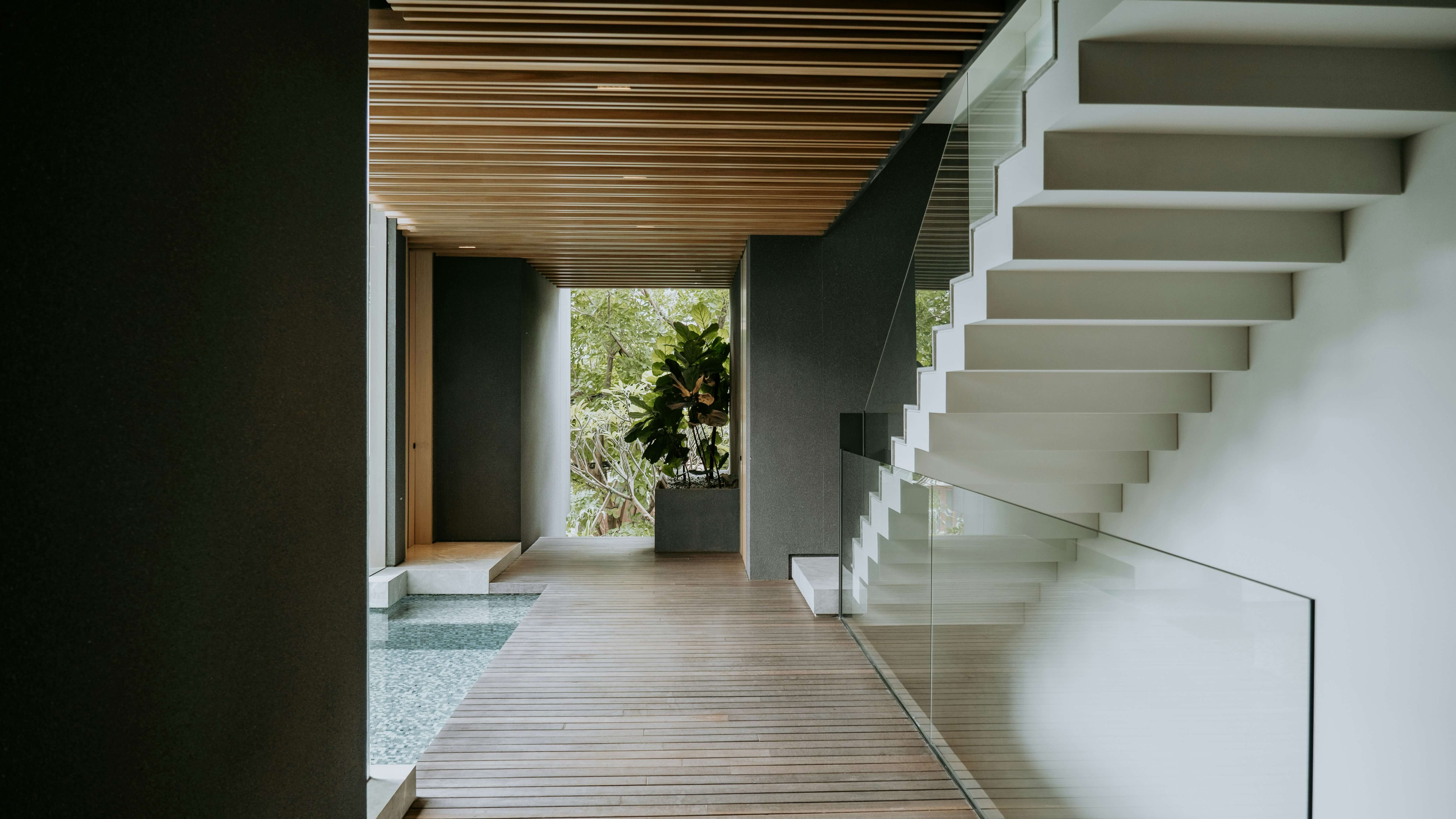 Glass staircase in Japanese inspired home