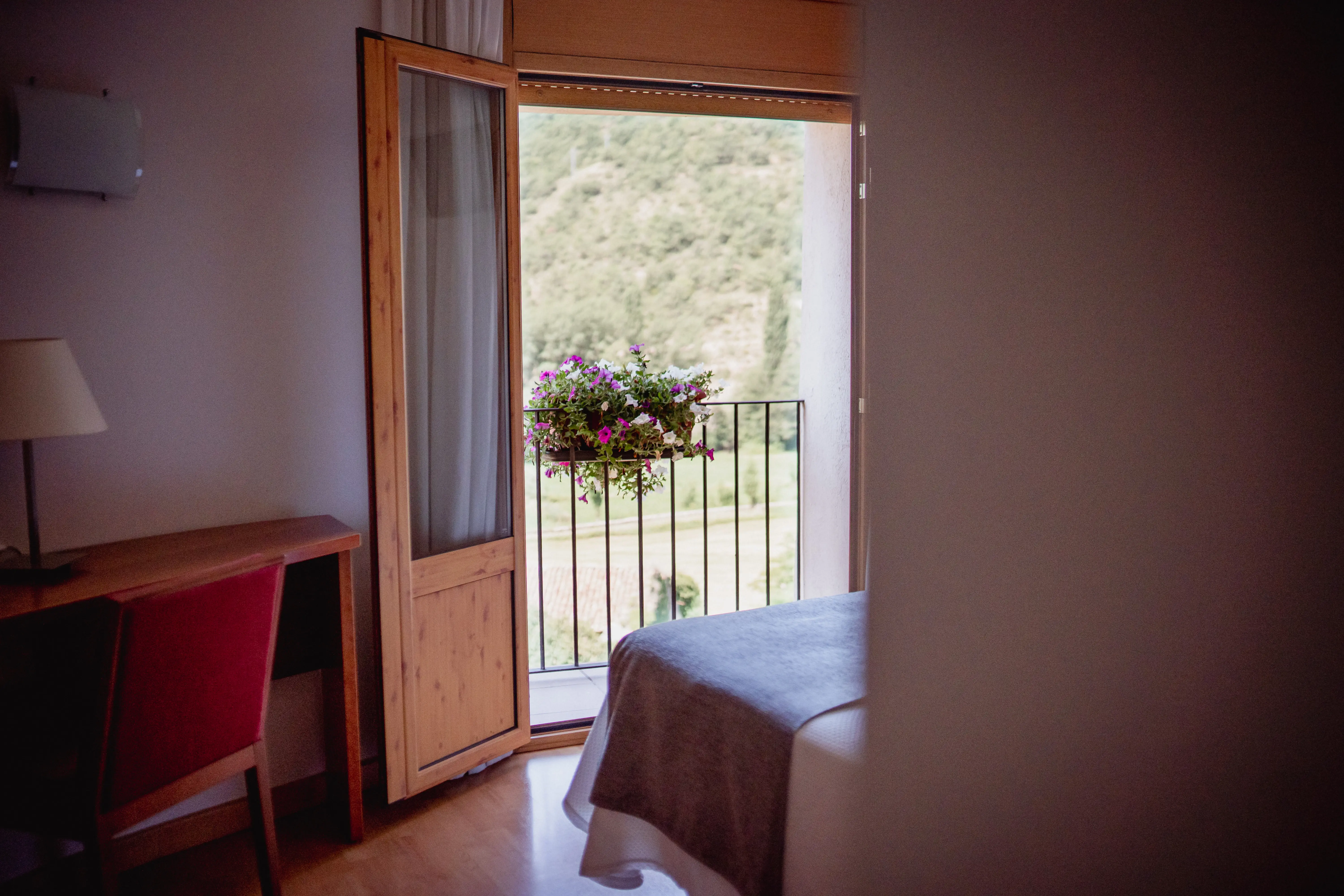 Sage green walls bedroom with lilac duvet and modern style