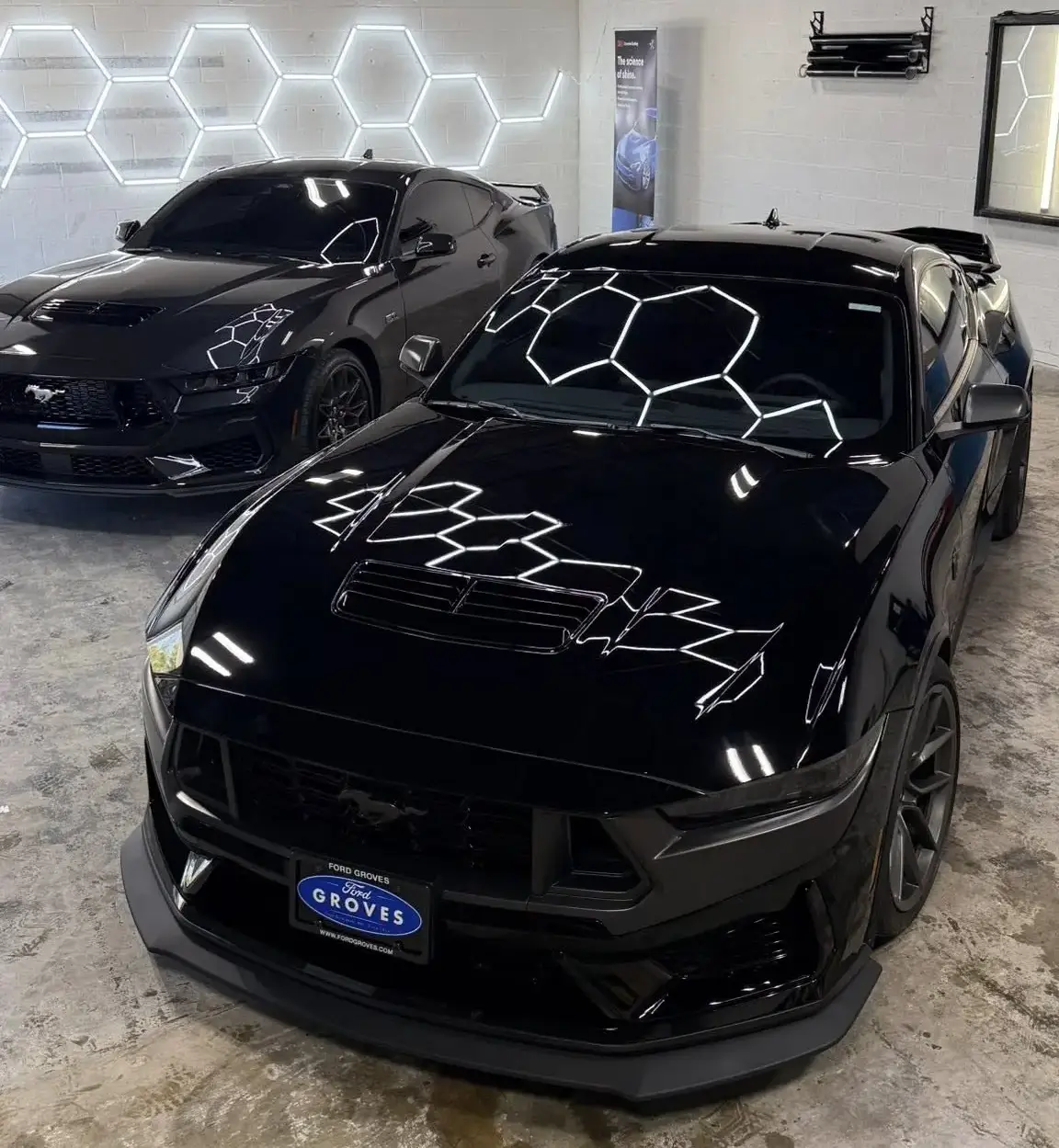 Shiny balck car in a detailing shop