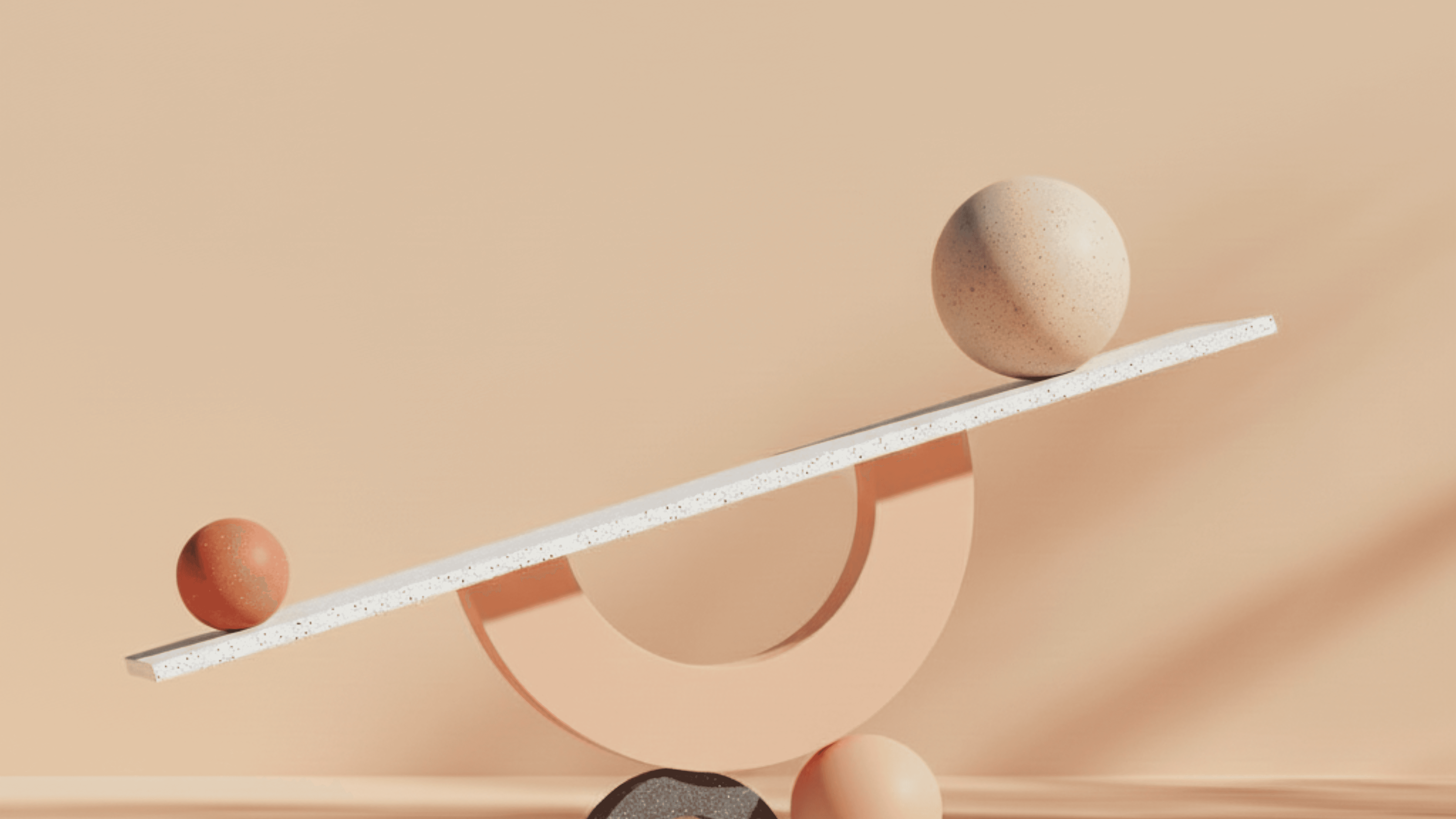 Abstract macro of a glass drop forming a black-and-white flower shape through light refraction on a soft gray background.