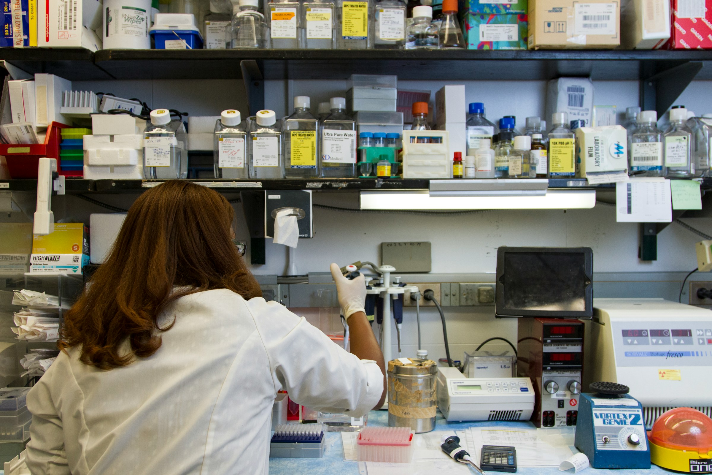 woman working in lab - Scientific Collaboration