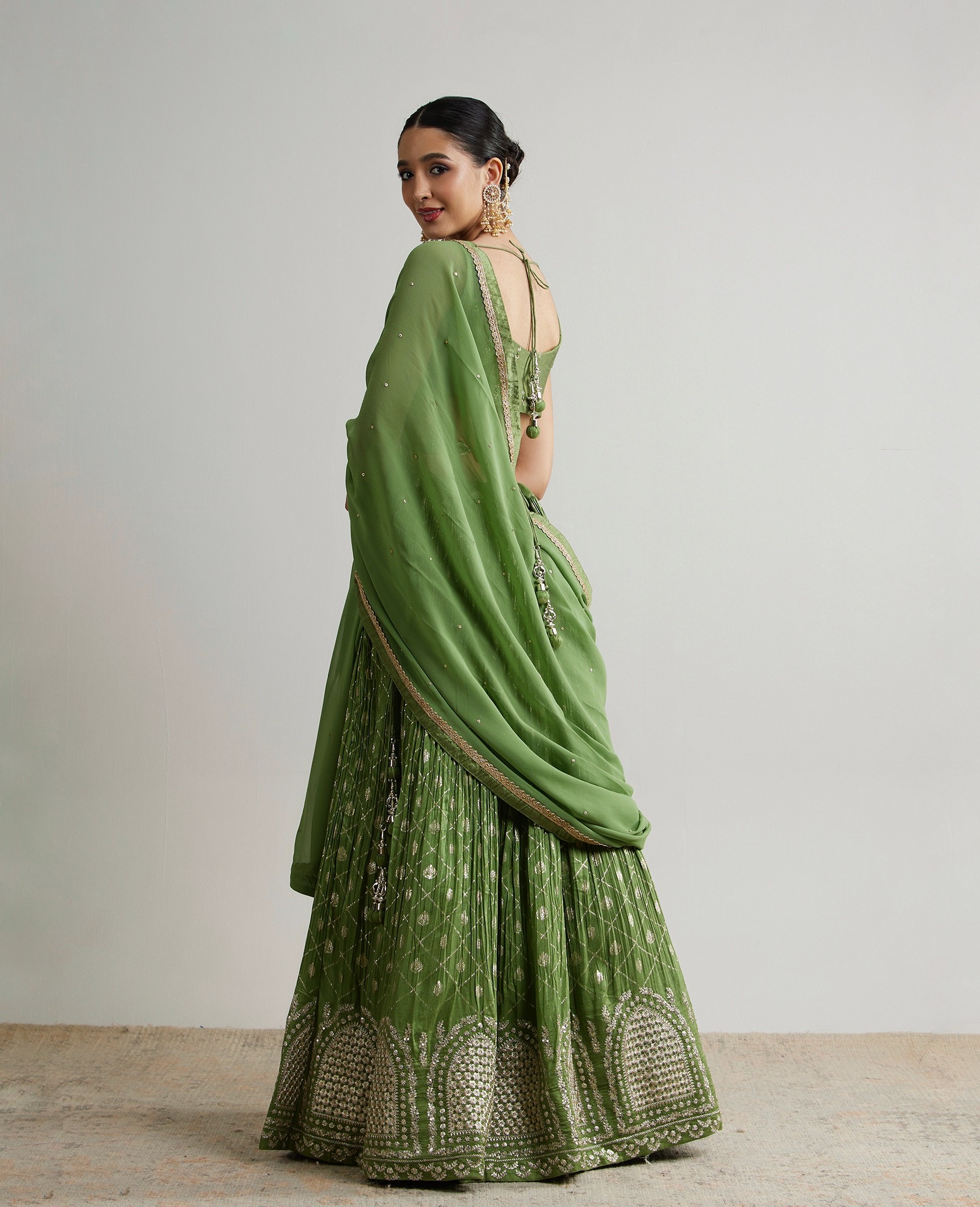 Group of friends smiling on a lively city street at night