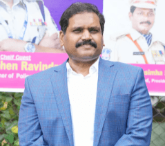 Athletes resting on a blue running track.