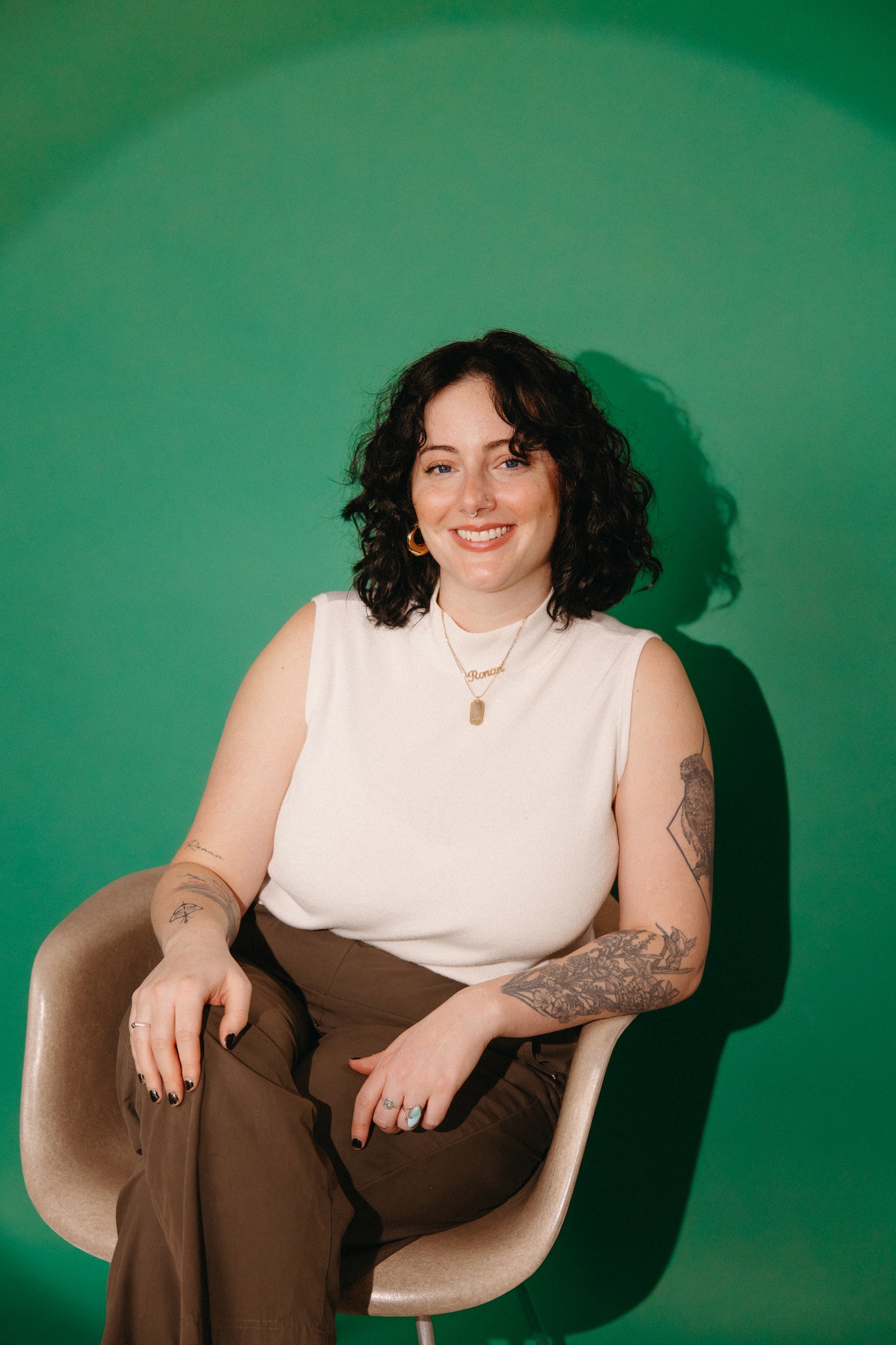 Headshot of Emily on a green backdrop