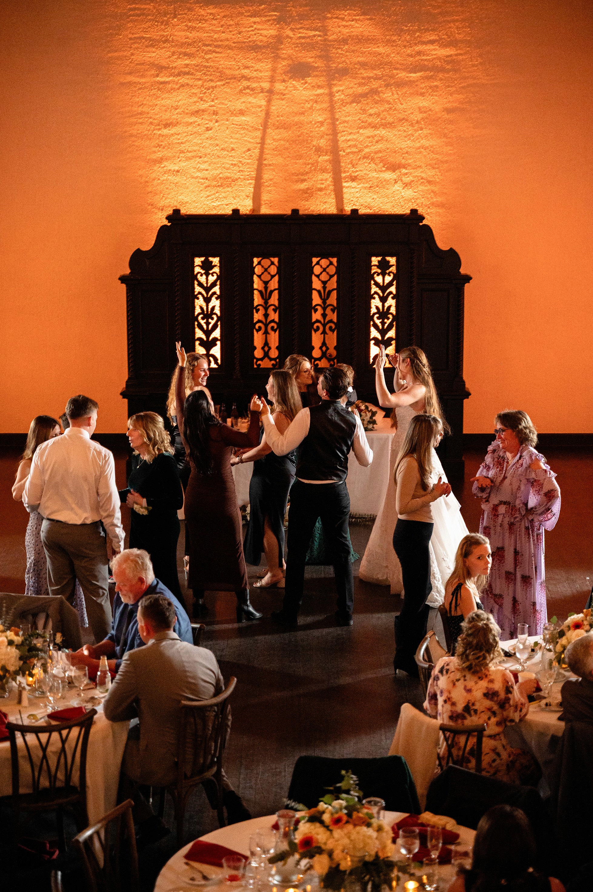 Flat lay wedding details with bouquet, rings, and sparkling bridal heels