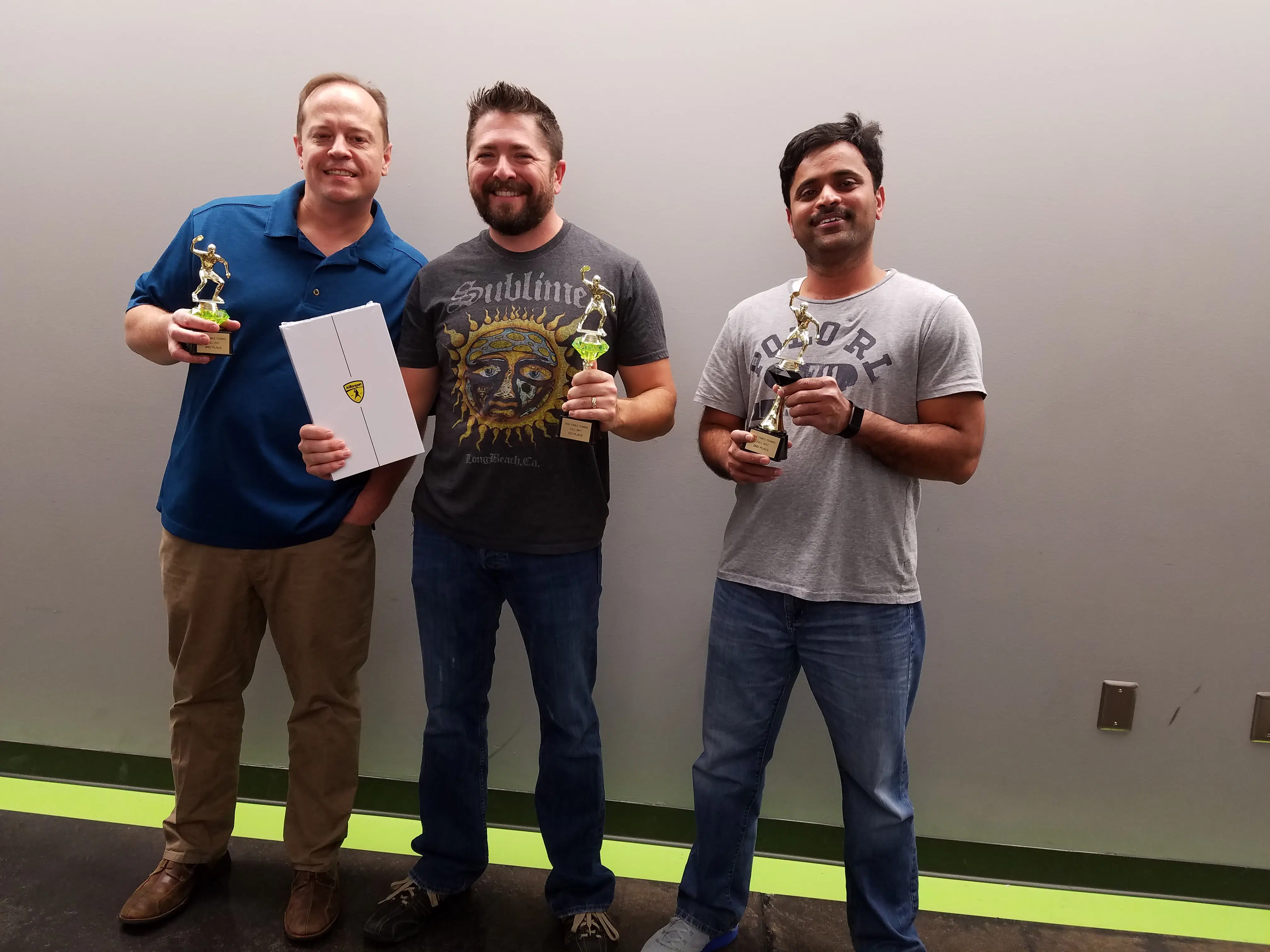 Smart Data Employees in the office having fun after winning a trophy