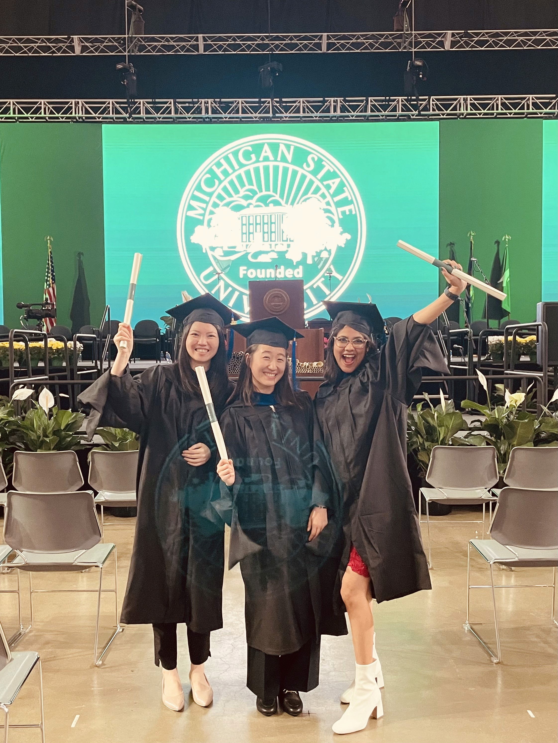 Friends laughing and posing inside a car