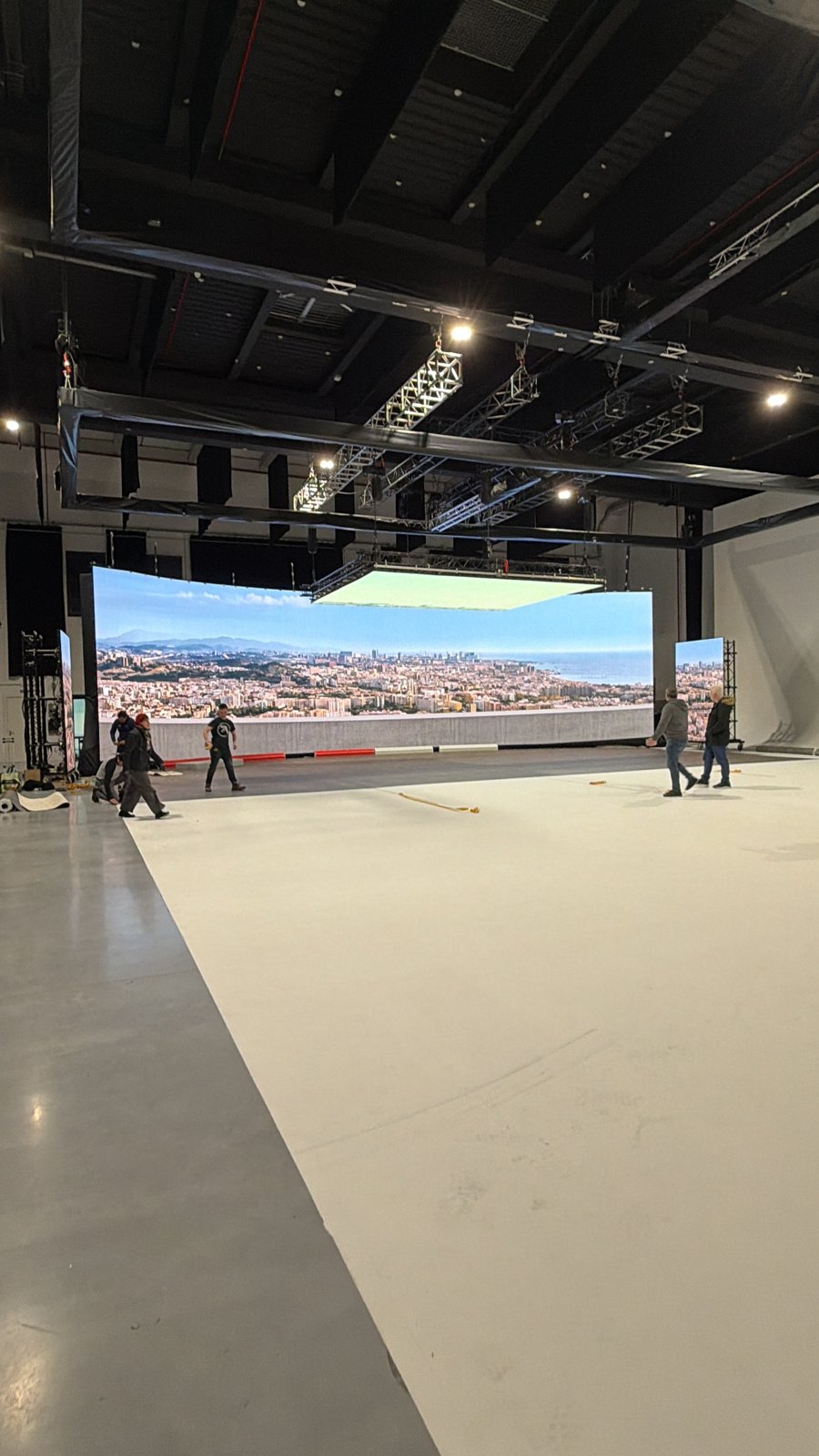 Behind the scenes: LED wall displaying a city background on an automotive filming stage