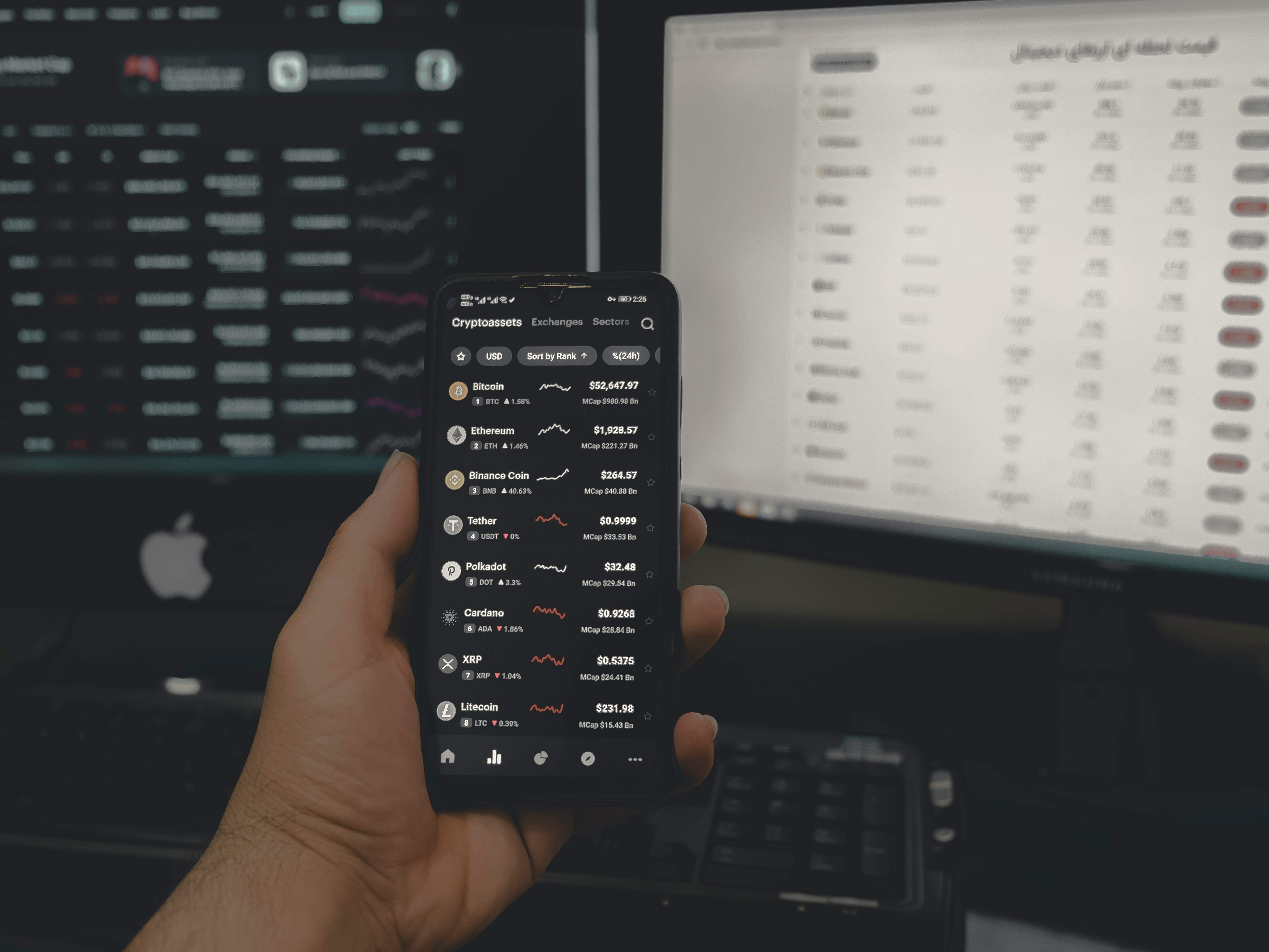 Person Showing Stats on Phone and Screens - Day Trade Crypto