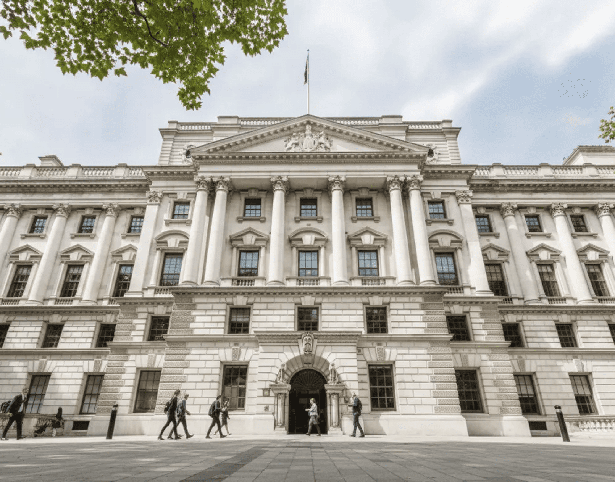 Historic government building facade with neoclassical columns and stone masonry architecture.