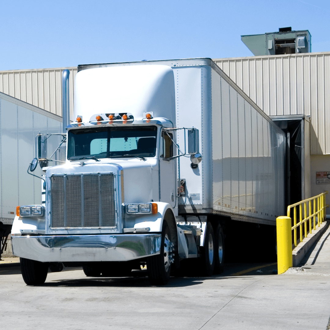 Truck arriving at scheduled dock appointment for loading/unloading operations.