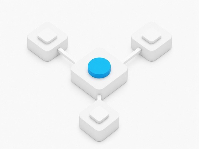 A blue circular button connected to four white blocks, forming a network-like structure against a white background.