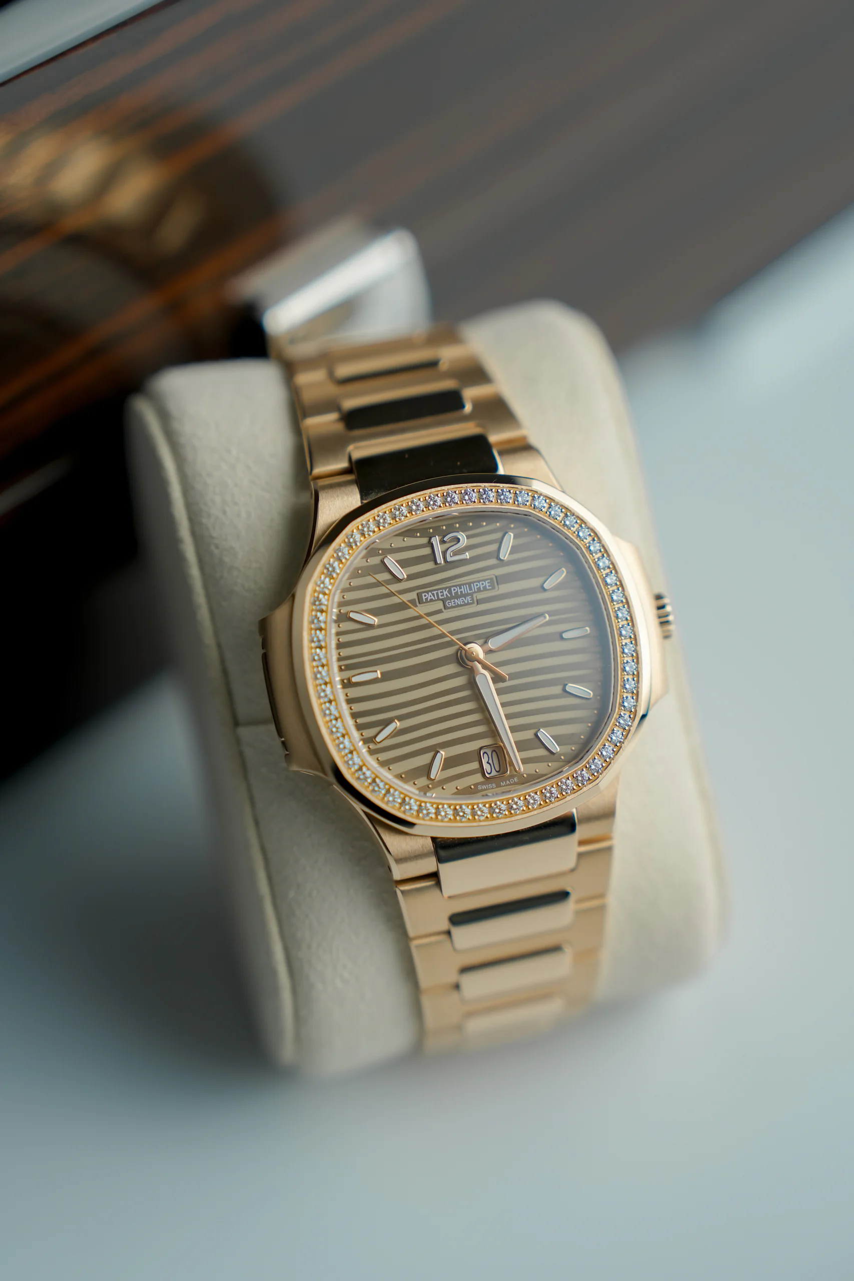 Angled view of the Patek Philippe Nautilus Rose Gold 7118/1200R showing the diamond-set bezel, available in Dubai