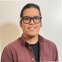 man in white crew neck shirt smiling