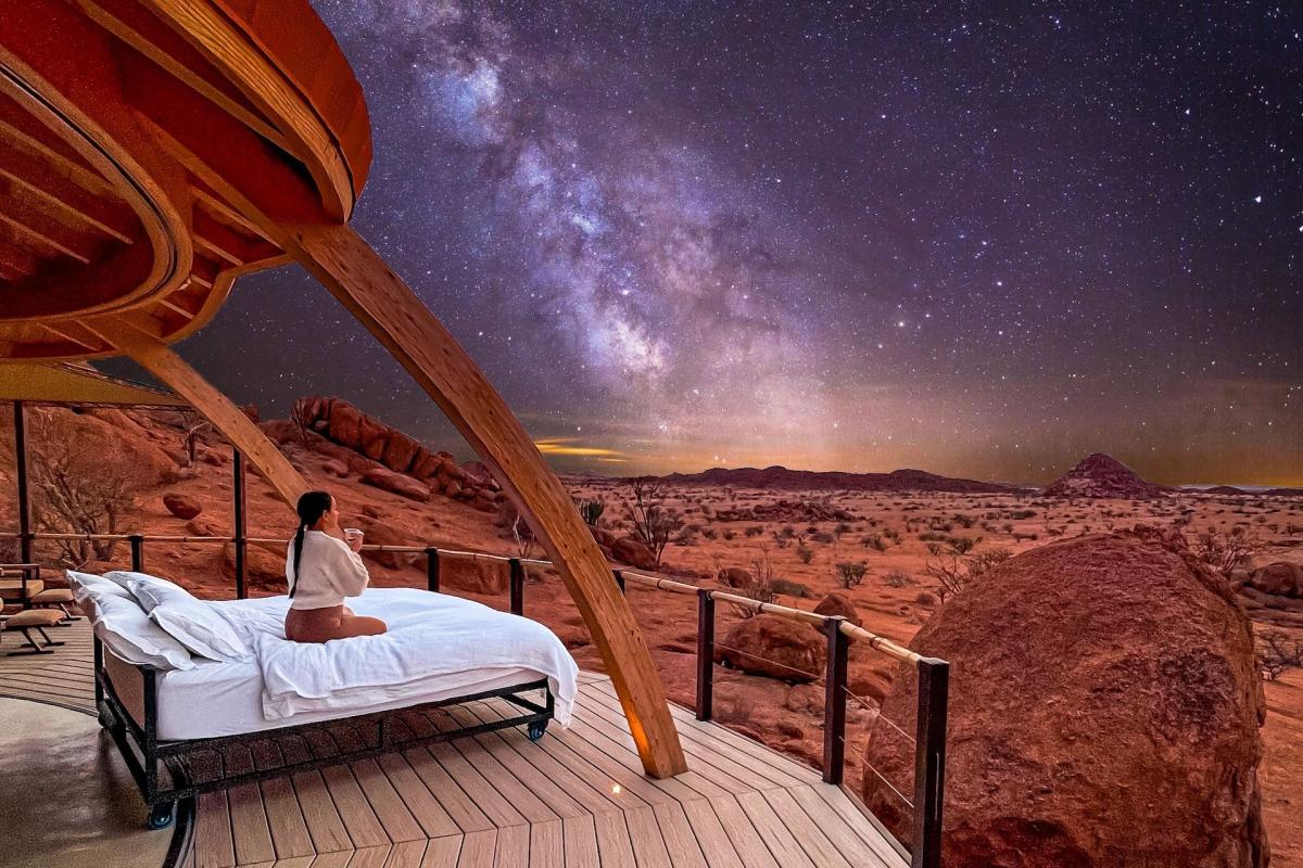 three brown wooden boat on blue lake water taken at daytime