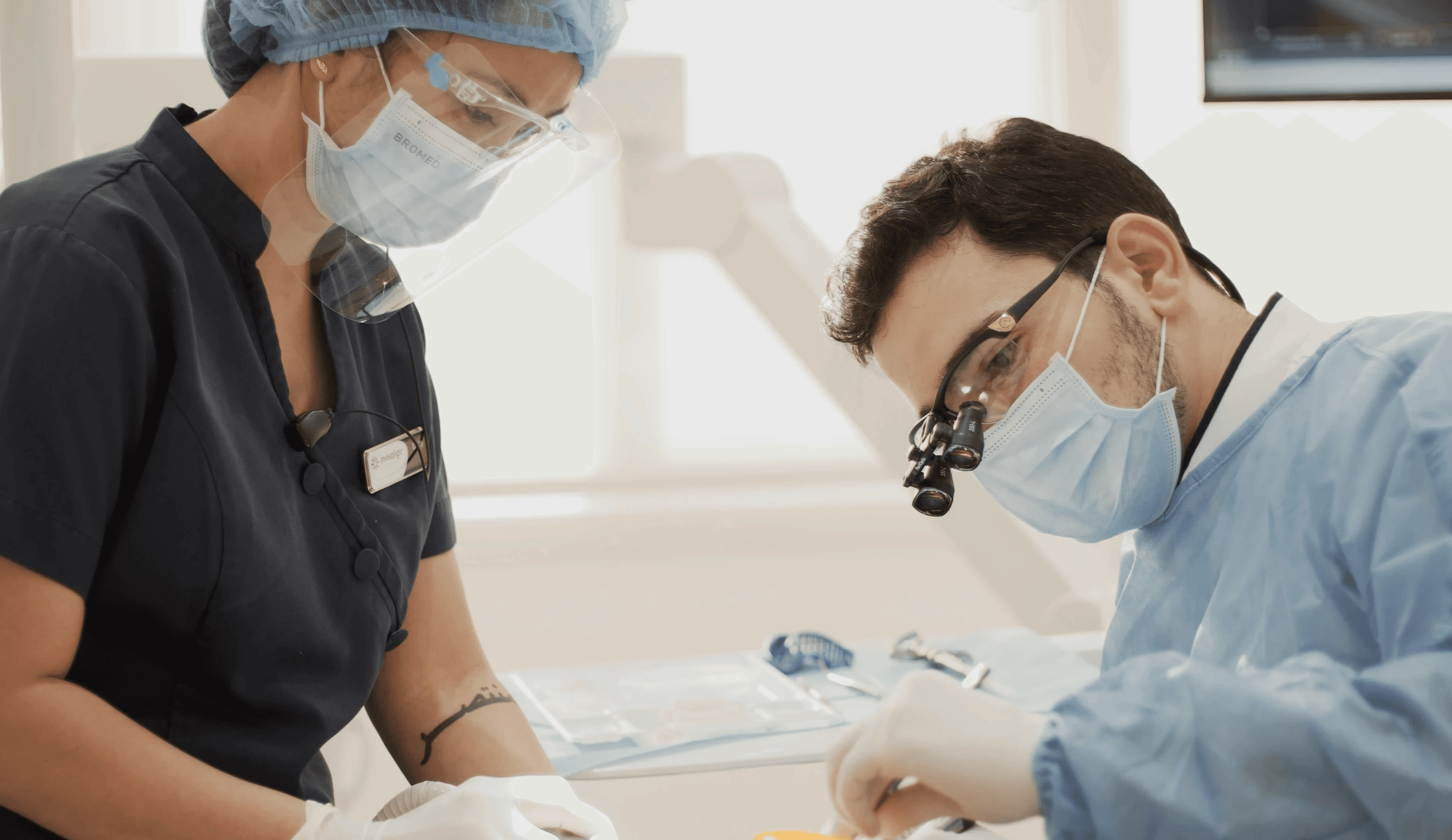 An expert Invisalign dentist doing a regular checkup for a patient, one of the ways to prevent a tooth cavity