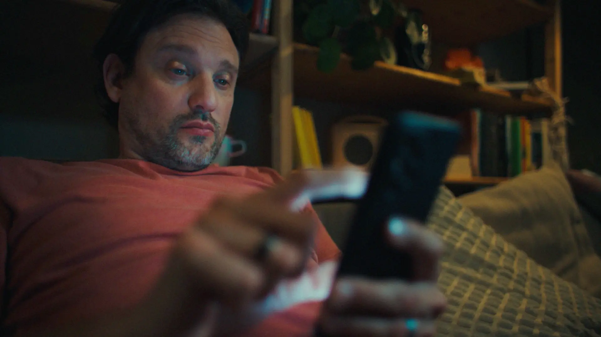 a man typing on his smartphone