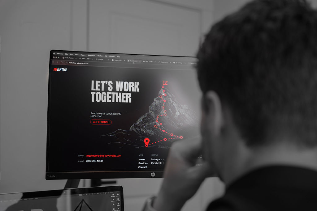 AdVantage Marketing Agency Employee looking at computer screen, on the screen is the Let's Work Together Page