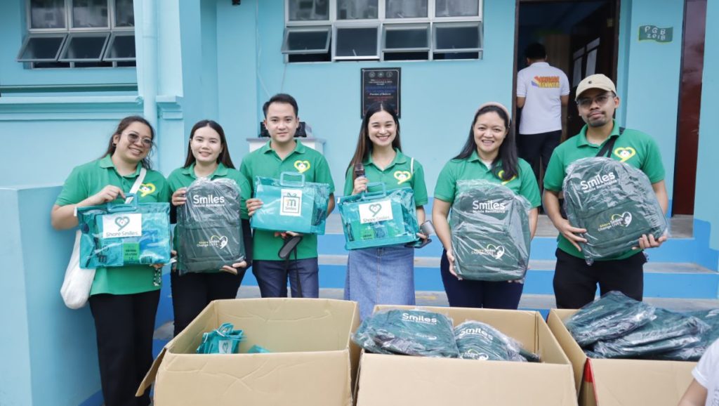 Smiles team with the backpacks