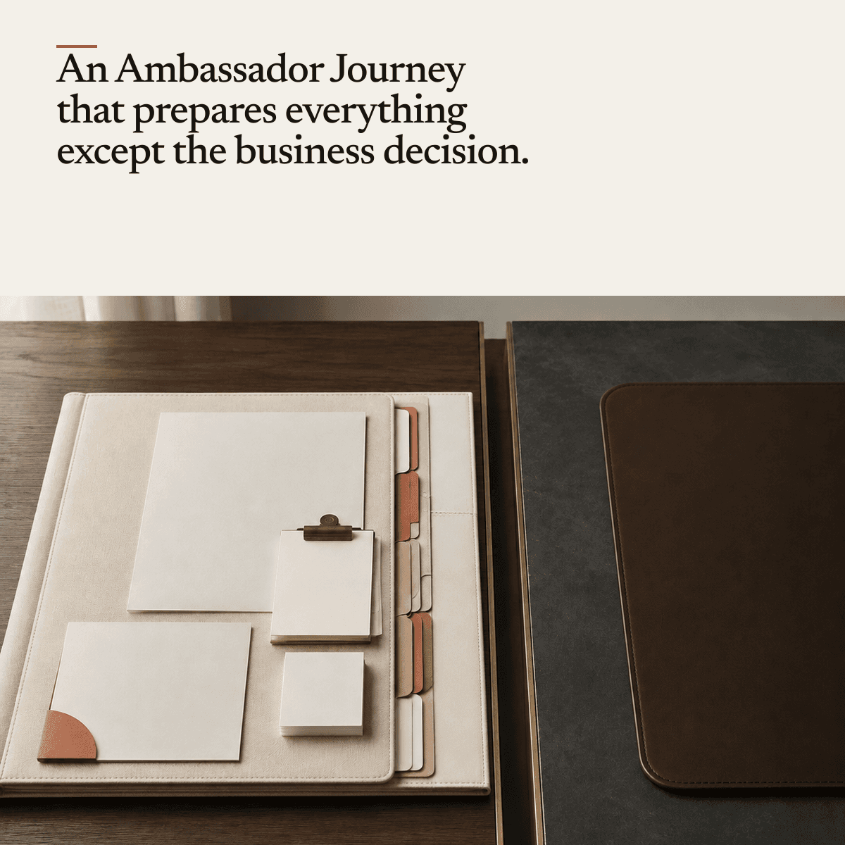 A tidy desk with a leather document folder, protruding index tabs, a clipboard and neat stacks of blank cards and paper, beside an empty leather desk pad.