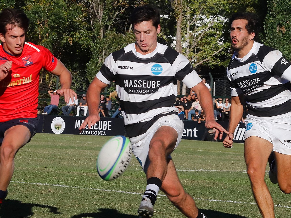 Rooftops of a coastal town with the sea in background