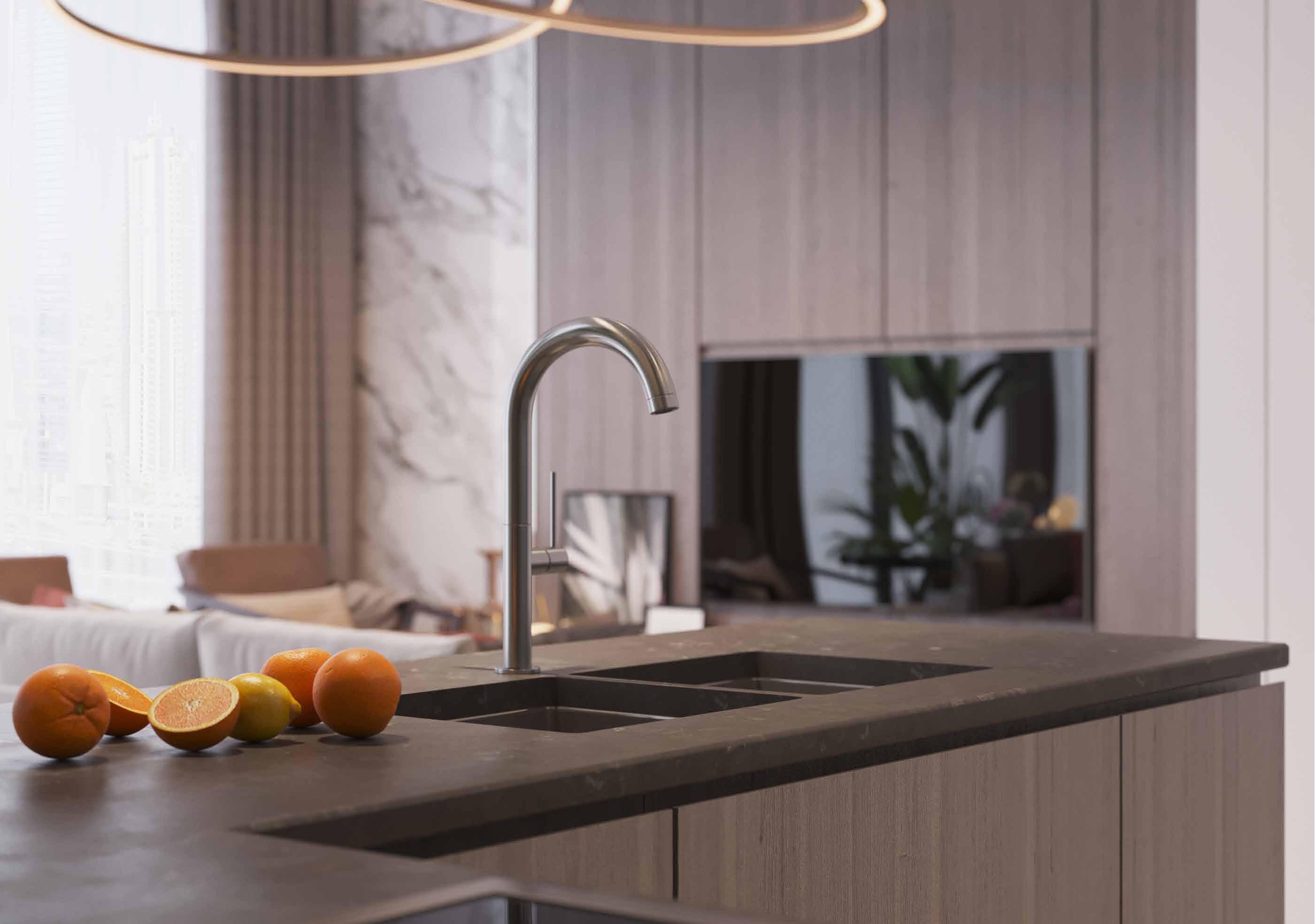 Close-up of a high-end kitchen sink and countertop, highlighting premium finishes in a luxury apartment.
