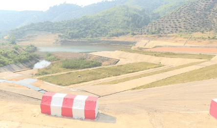Road paving machine laying asphalt on a street.