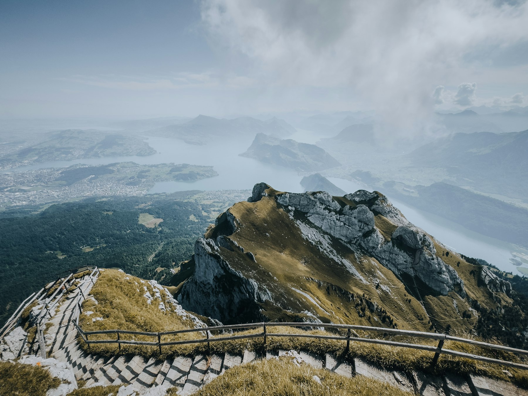 A wooden walkway on a mountain ridge