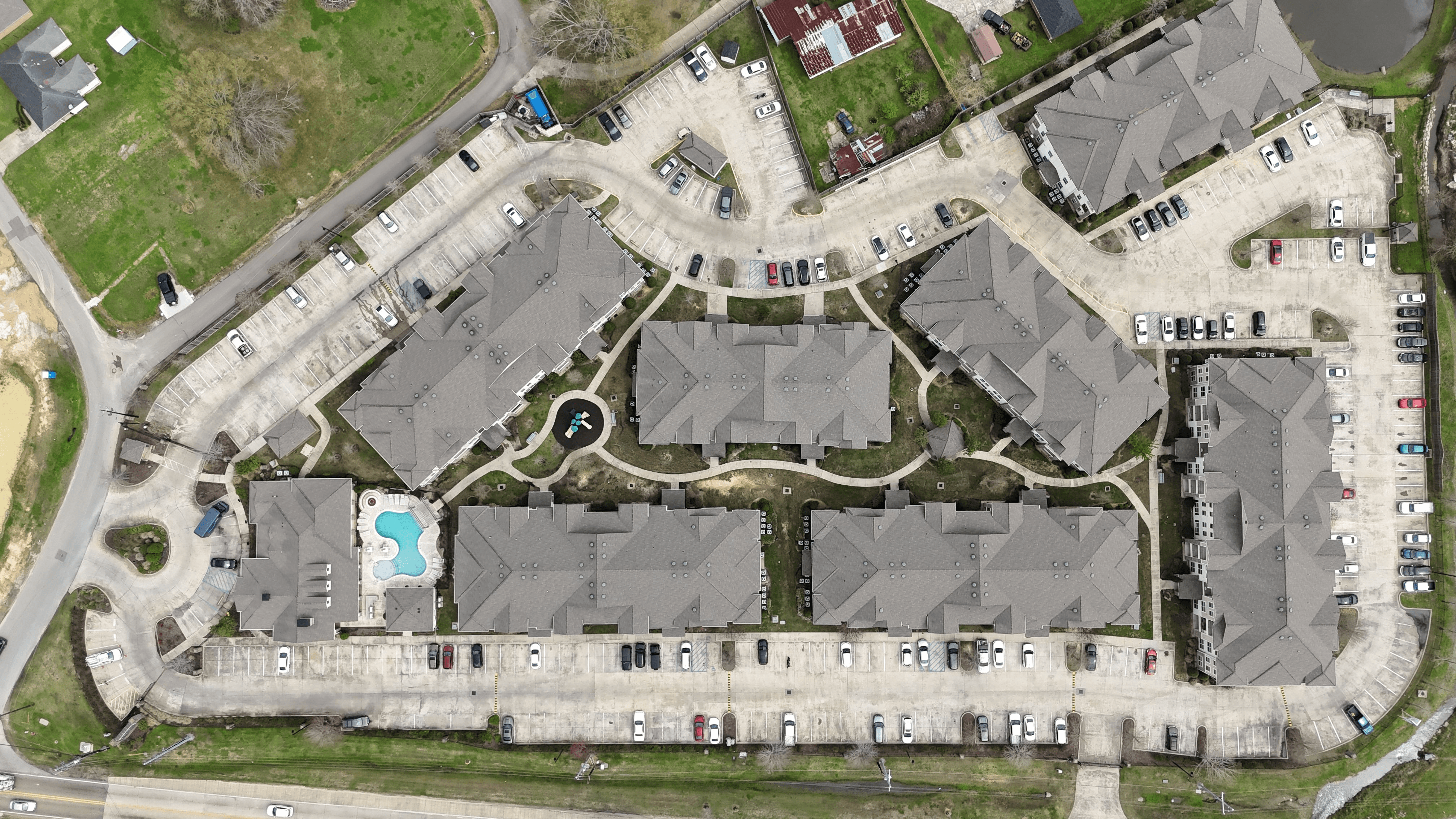 Top-down aerial view of the Creekside Crossing apartment community.