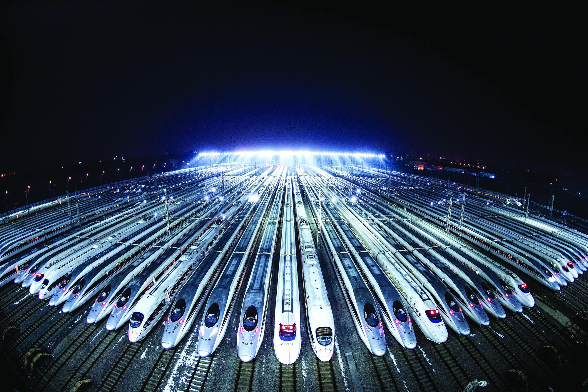 Futuristic railway yard with branching tracks symbolizing AI demand planning and the many paths for responding to demand.