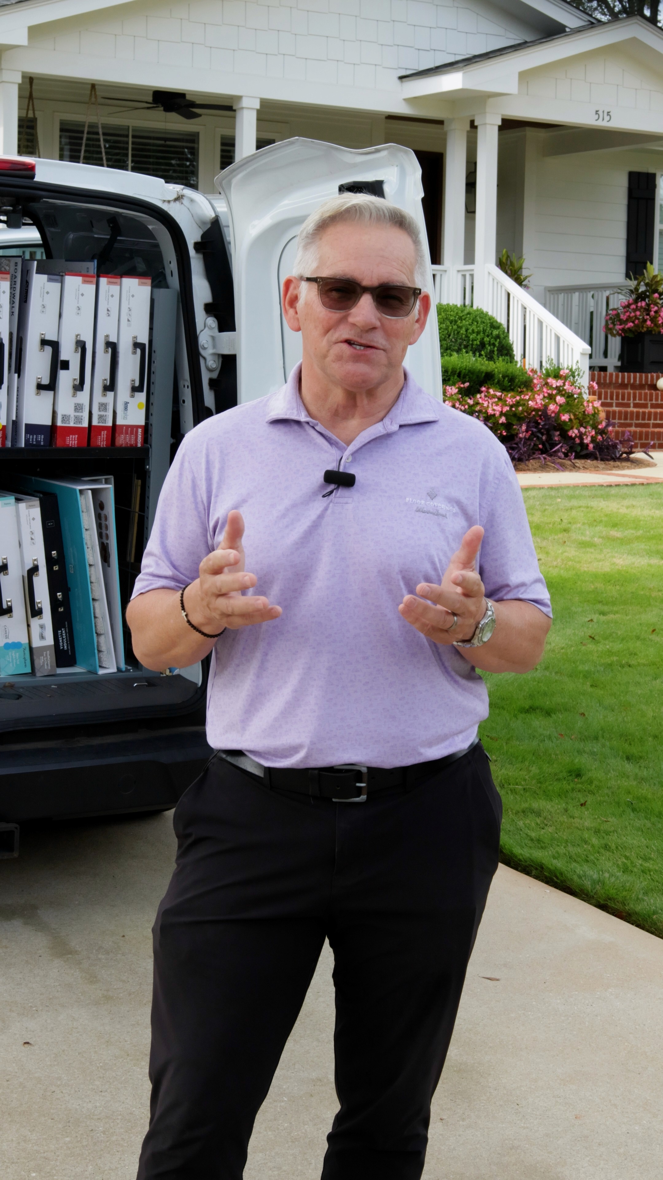 Close-up of a dark green leaf showing its textured surface and central vein against a muted background.