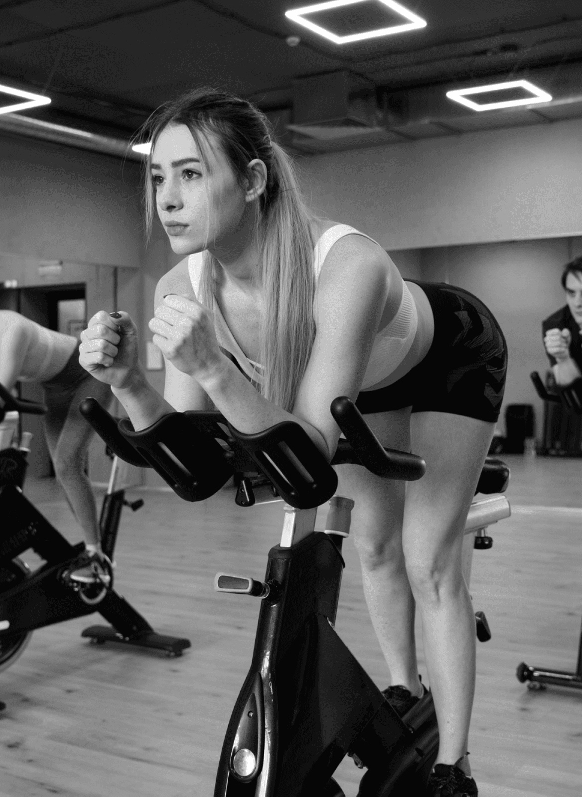 Energetic woman doing fusion of cycling