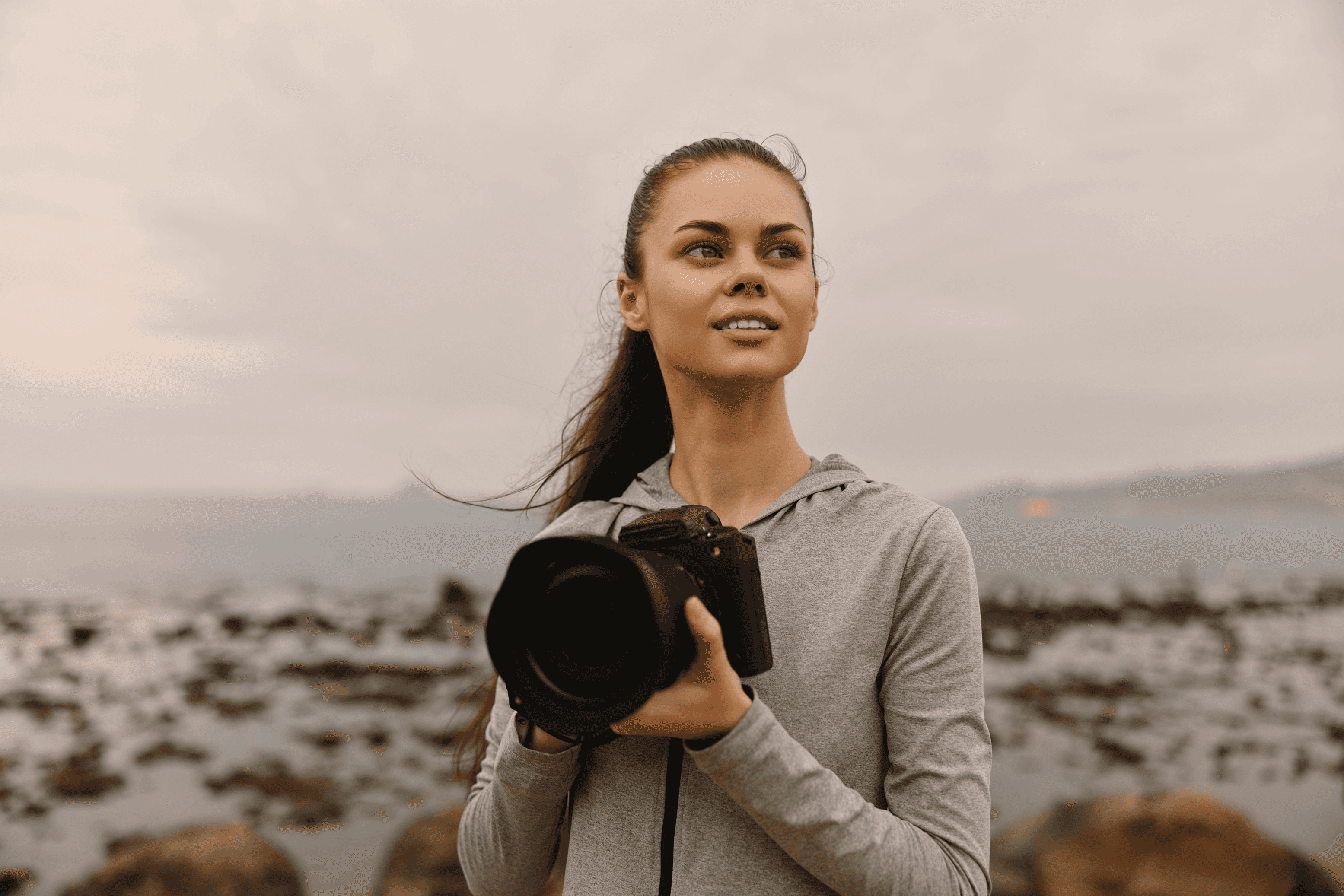 woman looking away and wearing a camera