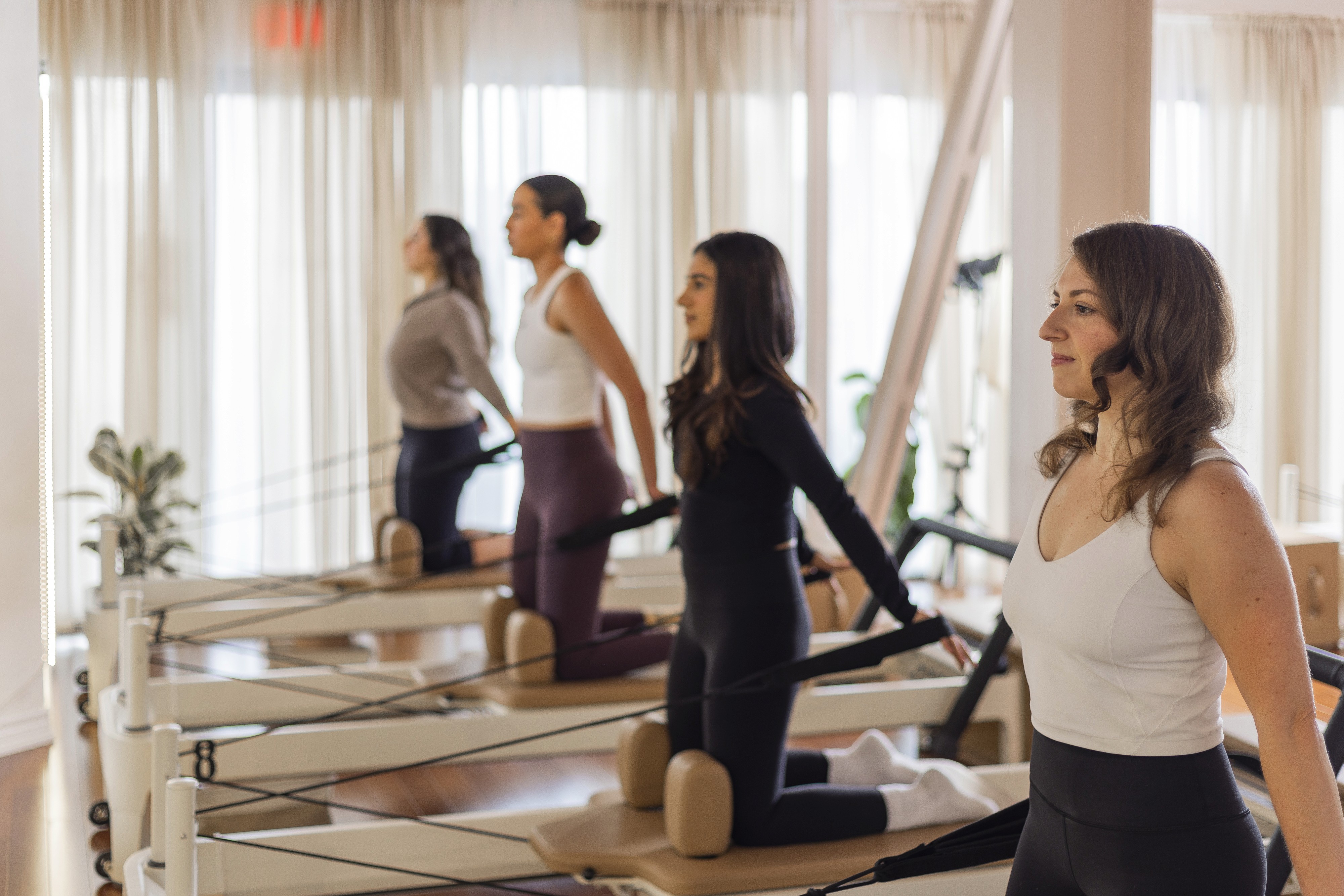 A group pilates class on modern Reformer equipment in west-end Toronto