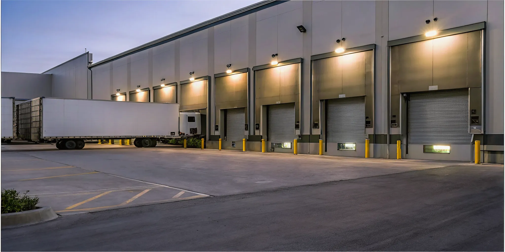 Secure loading dock with modern access control gates and delivery vehicles checking in