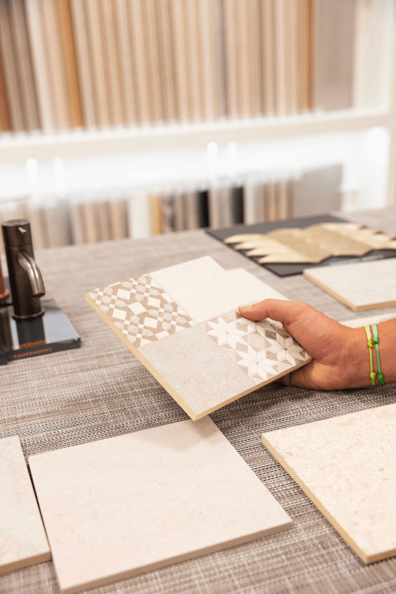 Smiling man and woman standing together in front of a framed abstract artwork.
