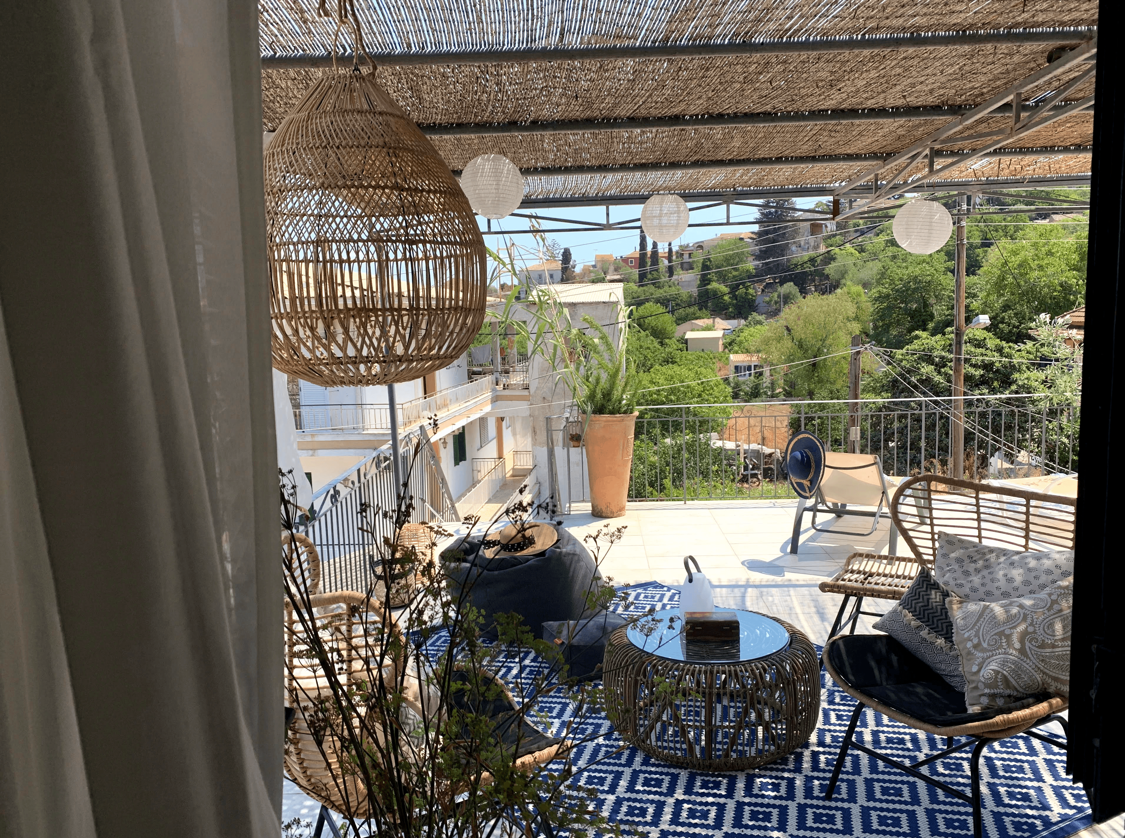 Large private terrace with outdoor dining area overlooking Liapades village