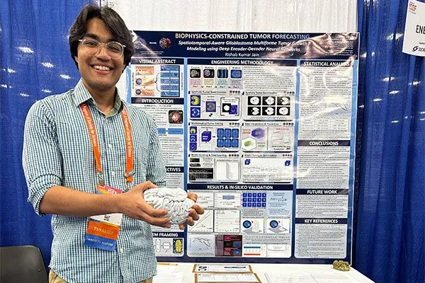 Rishab Jain next to his poster at ISEF